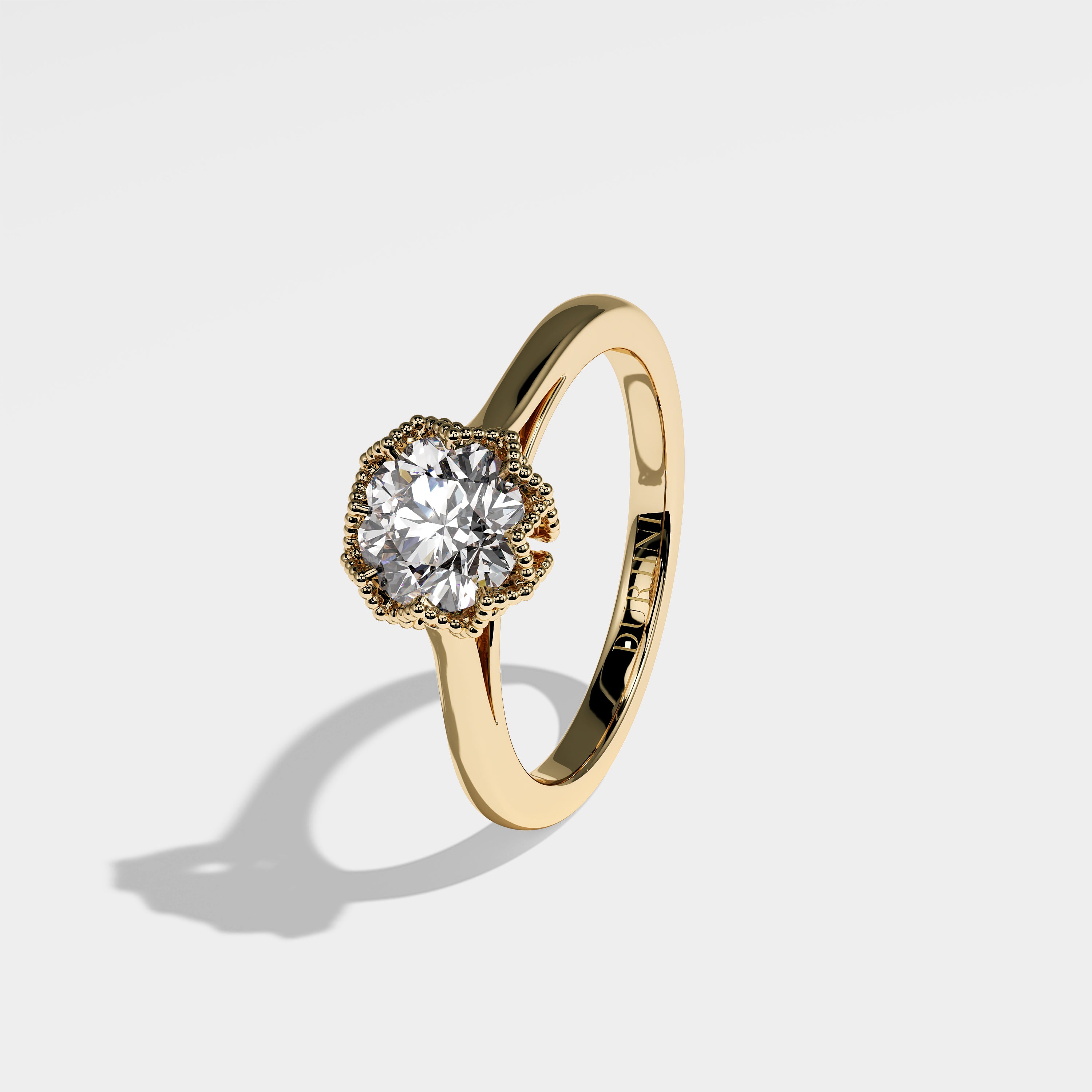 Maple round brilliant diamond engagement ring in 18K yellow gold by Kurbãni Durjini, left view