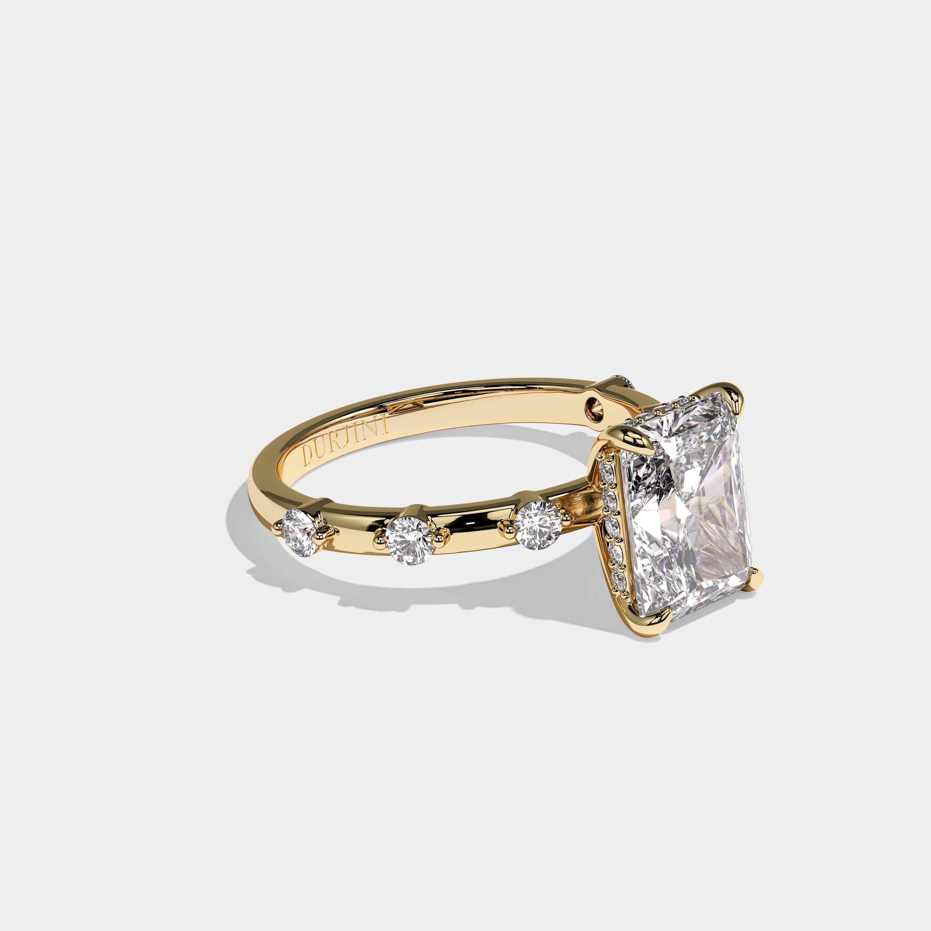 Anima radiant halo diamond engagement ring in 18K yellow gold by Kurbãni Durjini, right view