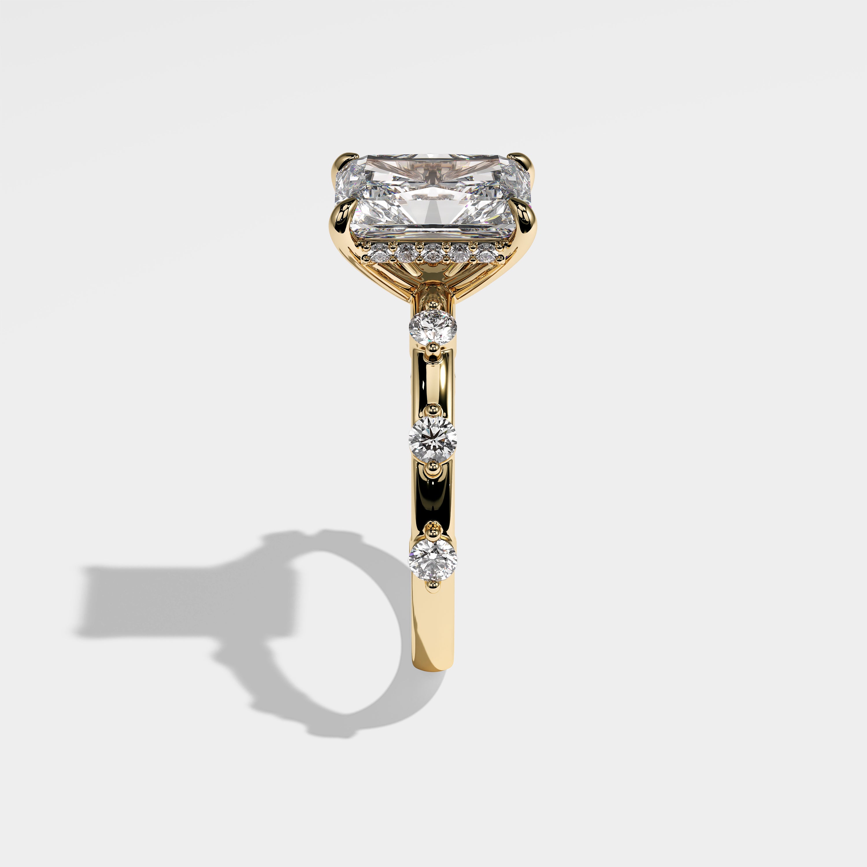 Anima radiant halo diamond engagement ring in 18K yellow gold by Kurbãni Durjini, side view