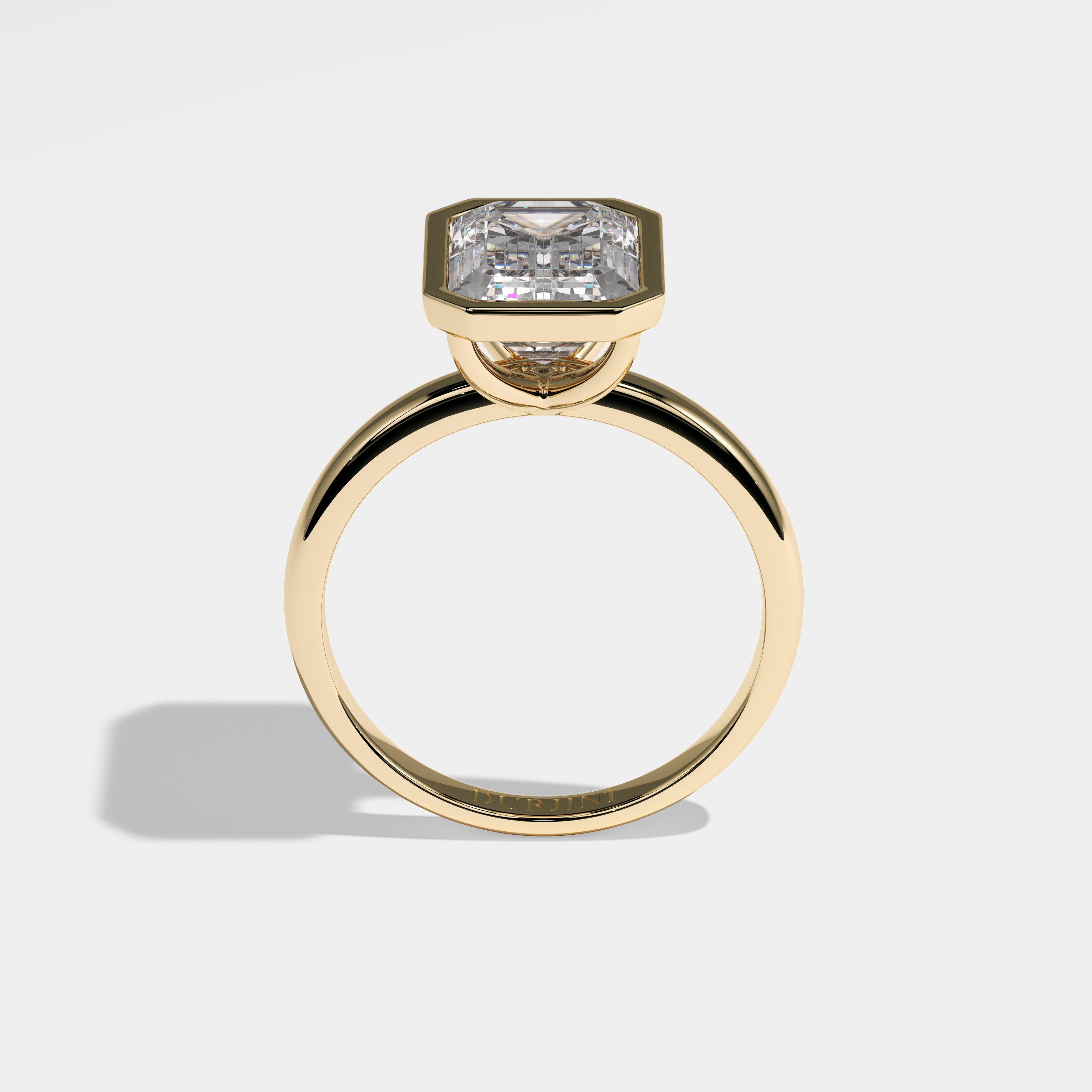 High emerald-cut diamond engagement ring in 18K yellow gold by Kurbãni Durjini, full view
