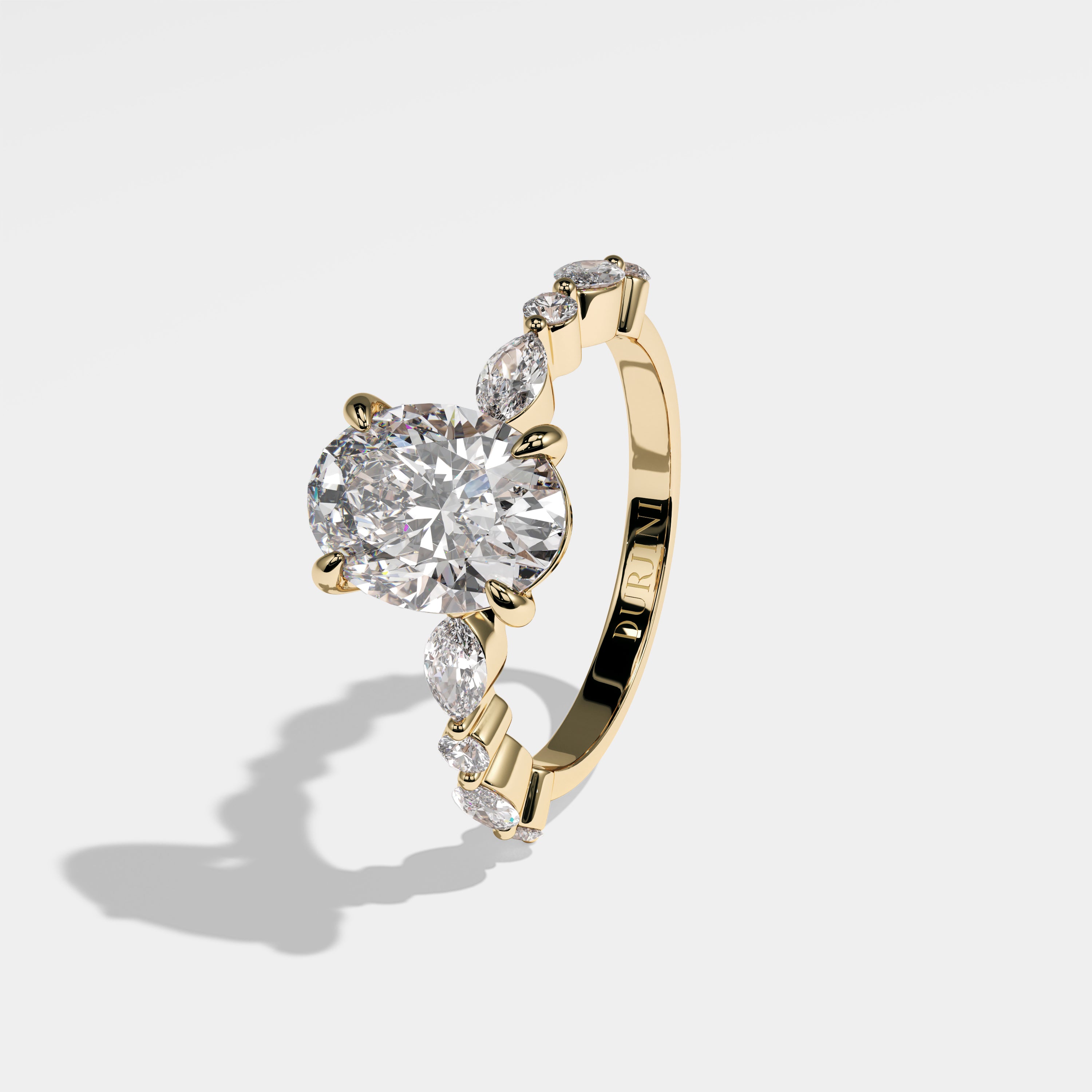 Strength oval diamond engagement ring in 18K yellow gold by Kurbãni Durjini, left view