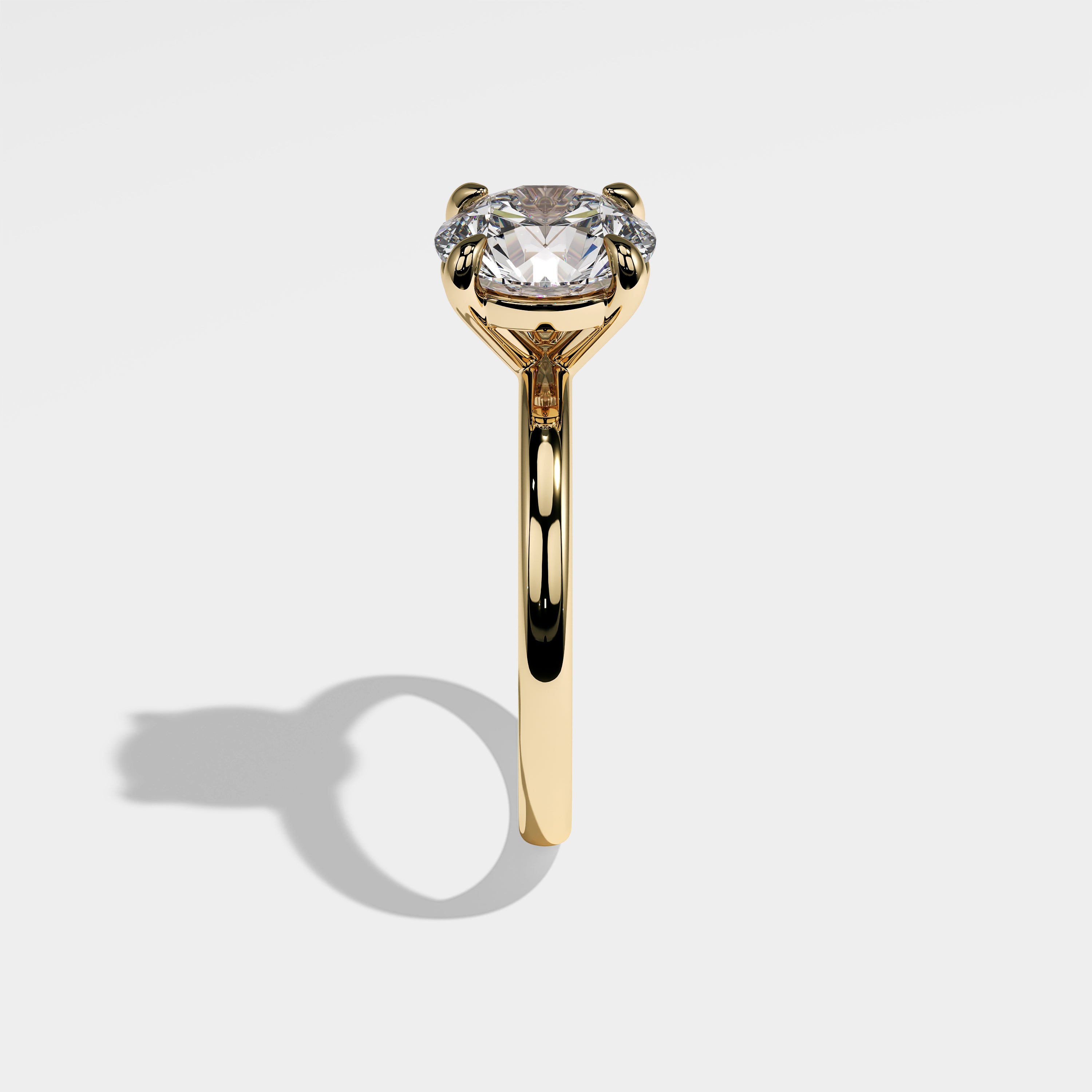 Granite round brilliant diamond engagement ring in 18K yellow gold by Kurbãni Durjini, side view