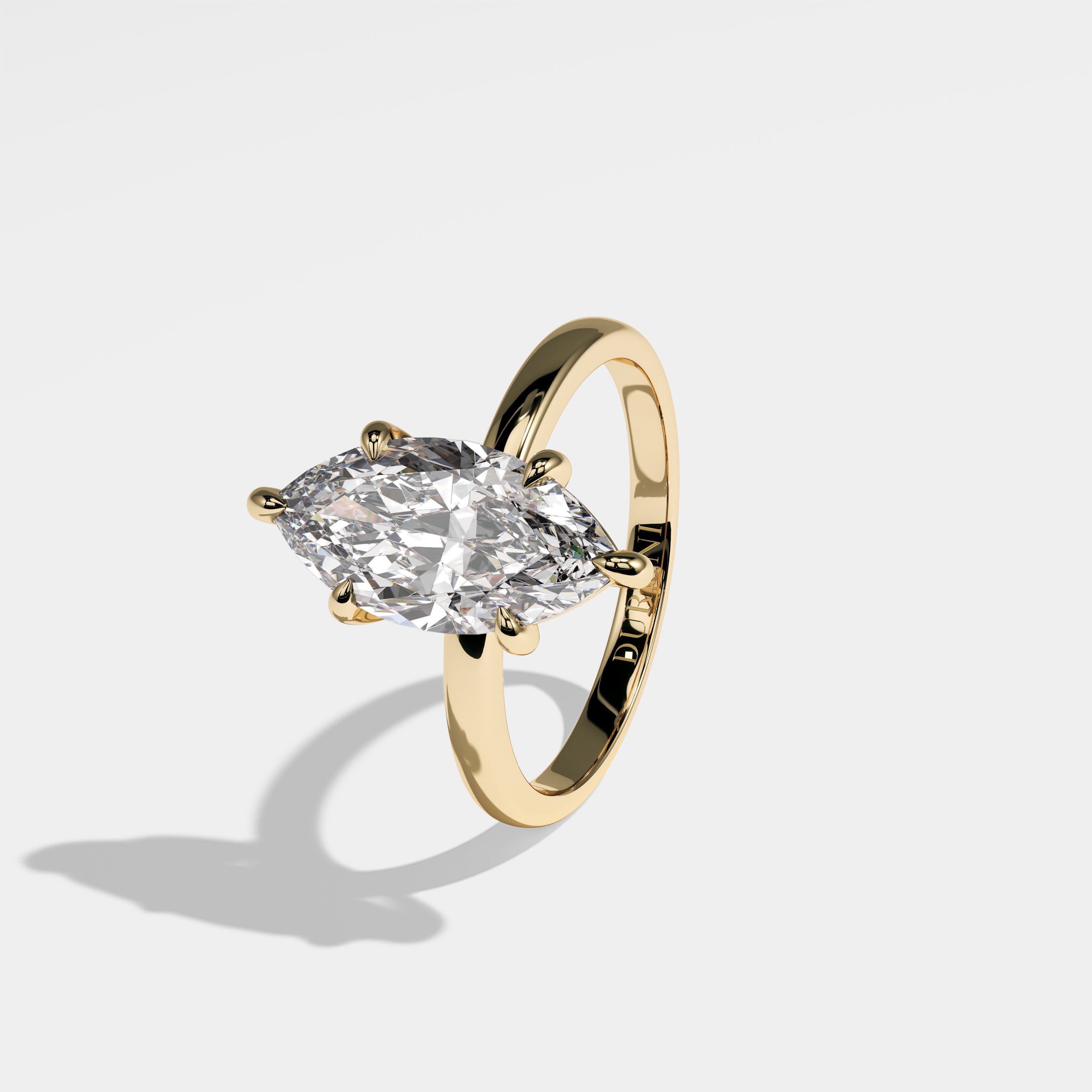 Britain marquise diamond engagement ring in 18K yellow gold by Kurbãni Durjini, left view