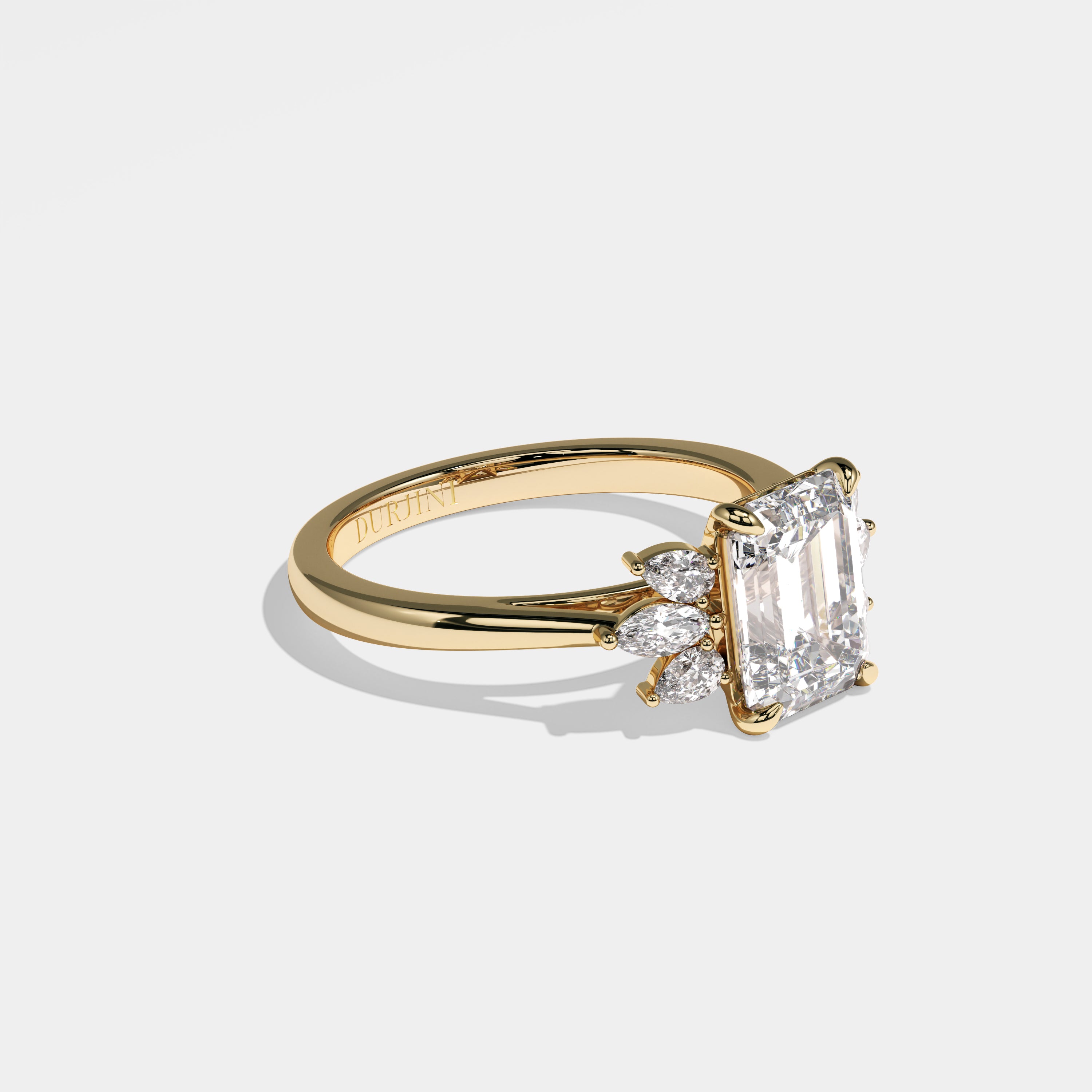 Lion emerald-cut diamond engagement ring in 18K yellow gold by Kurbãni Durjini, right view