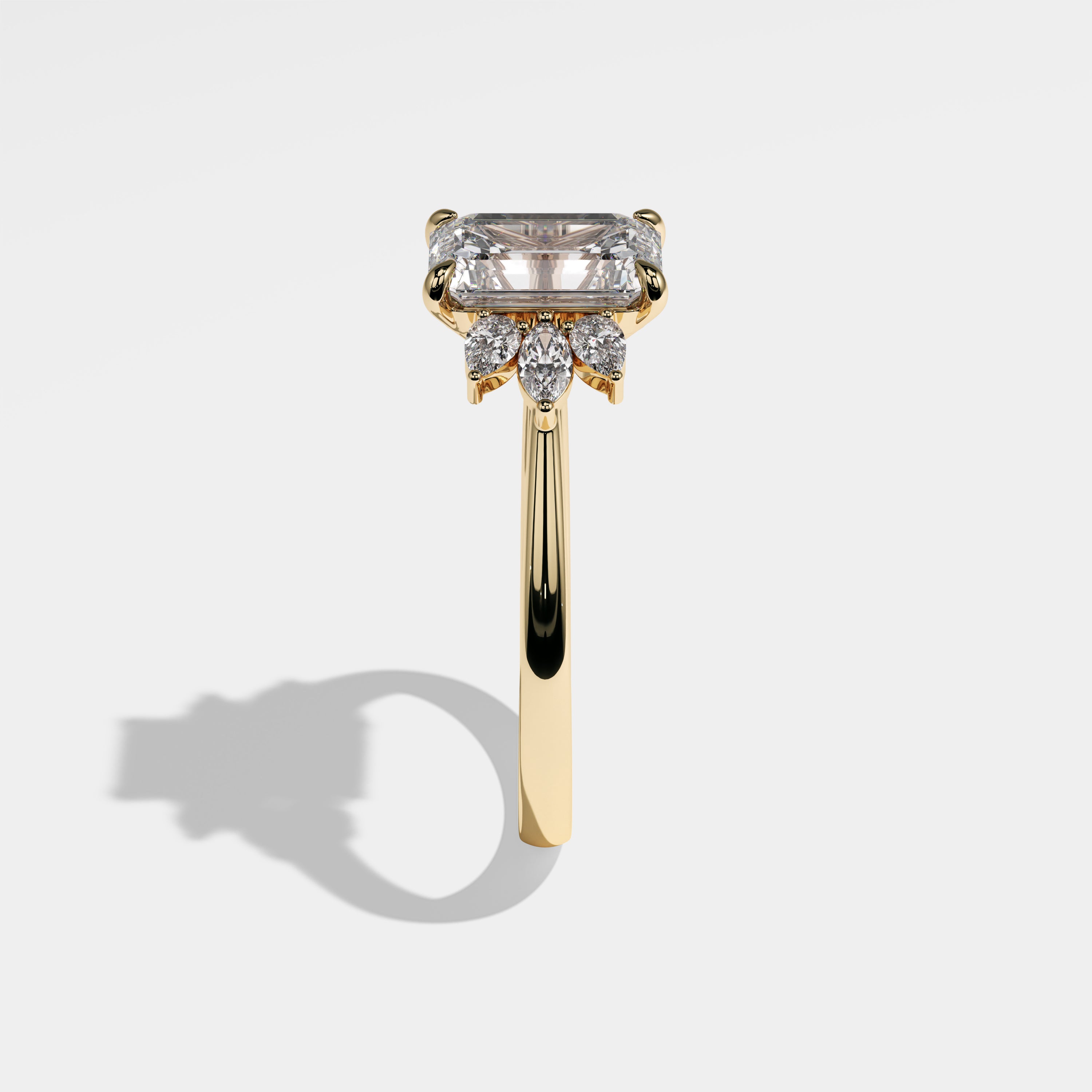 Lion emerald-cut diamond engagement ring in 18K yellow gold by Kurbãni Durjini, side view