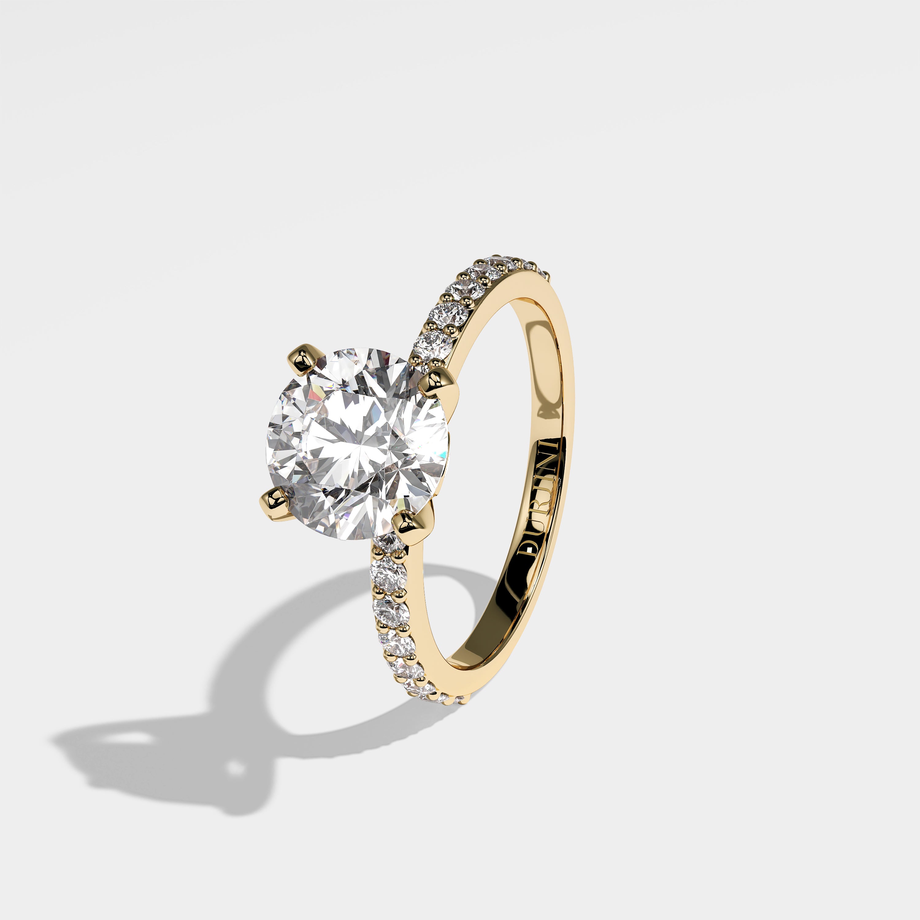 Feather round brilliant diamond engagement ring in 18K yellow gold by Kurbãni Durjini, left view