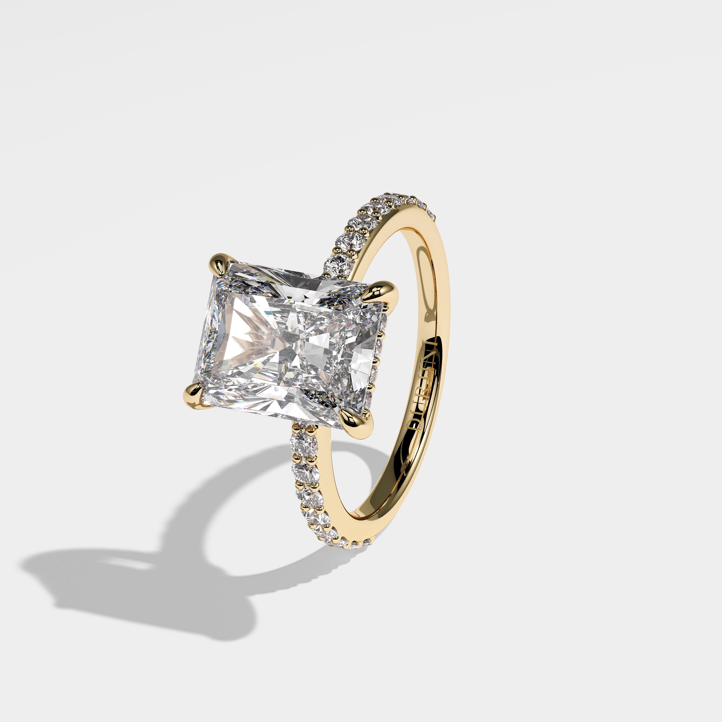 Aseela radiant halo diamond engagement ring in 18K yellow gold by Kurbãni Durjini, left view