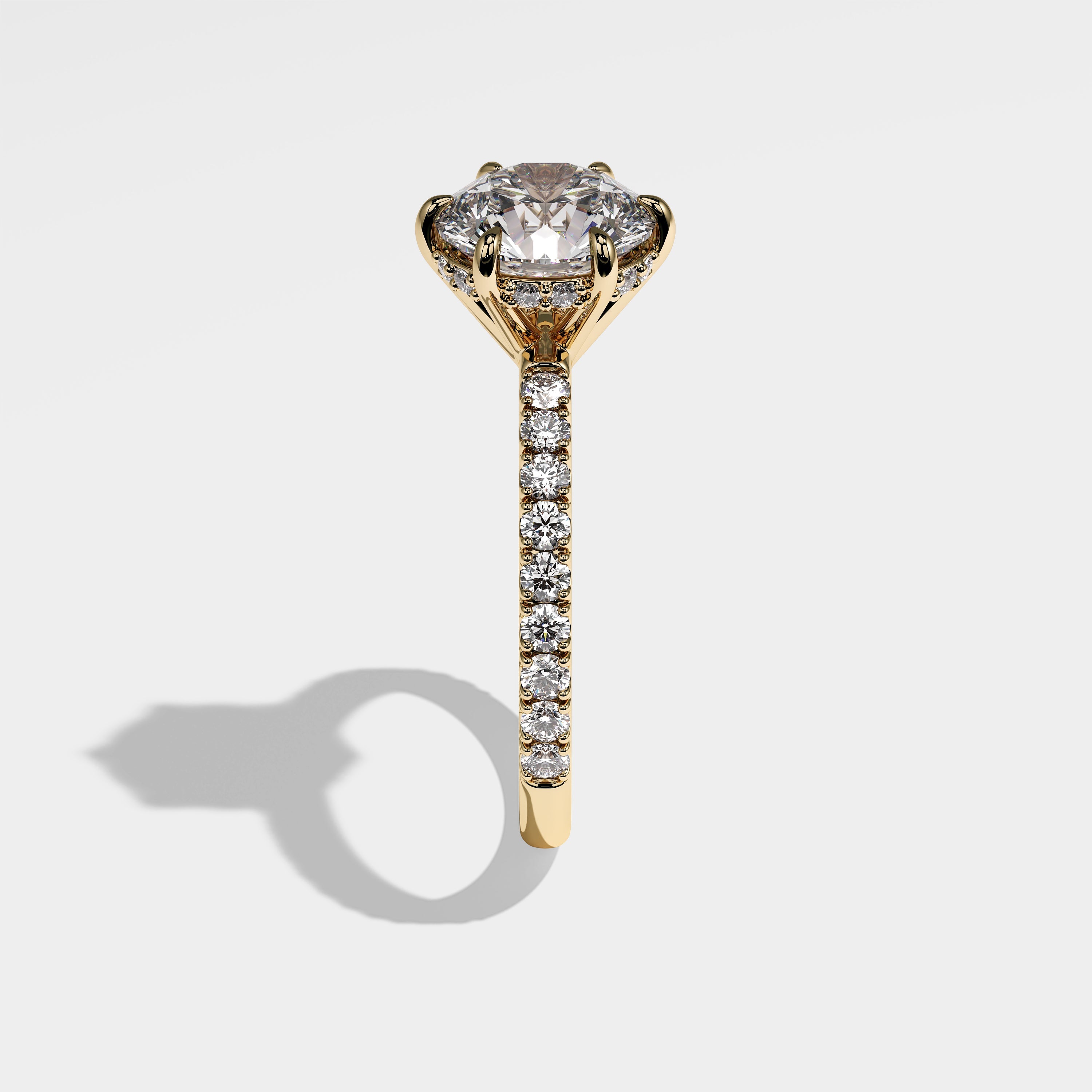 Starlight round brilliant halo diamond engagement ring in 18K yellow gold by Kurbãni Durjini, side view
