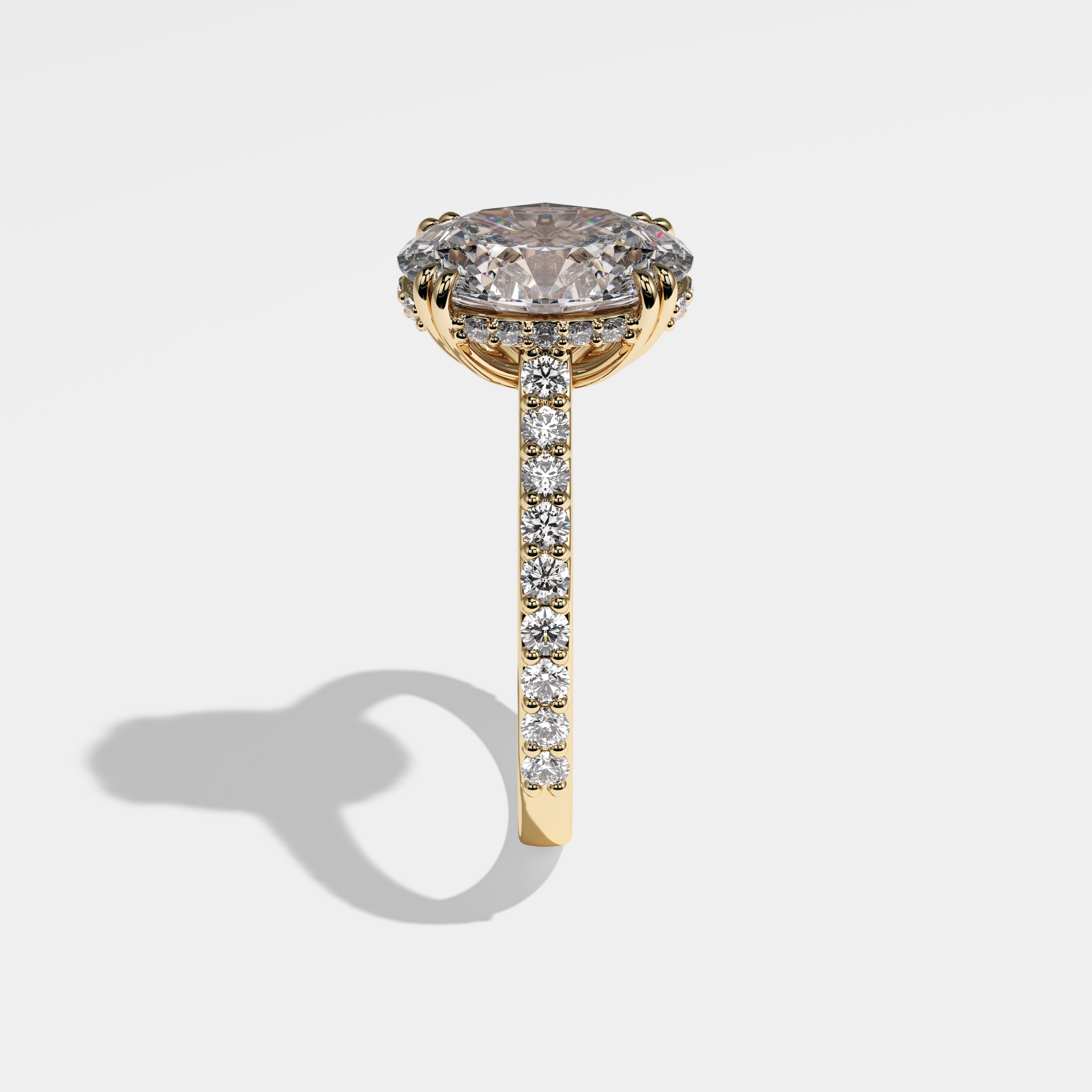 Midnight oval halo diamond engagement ring in 18K yellow gold by Kurbãni Durjini, side view