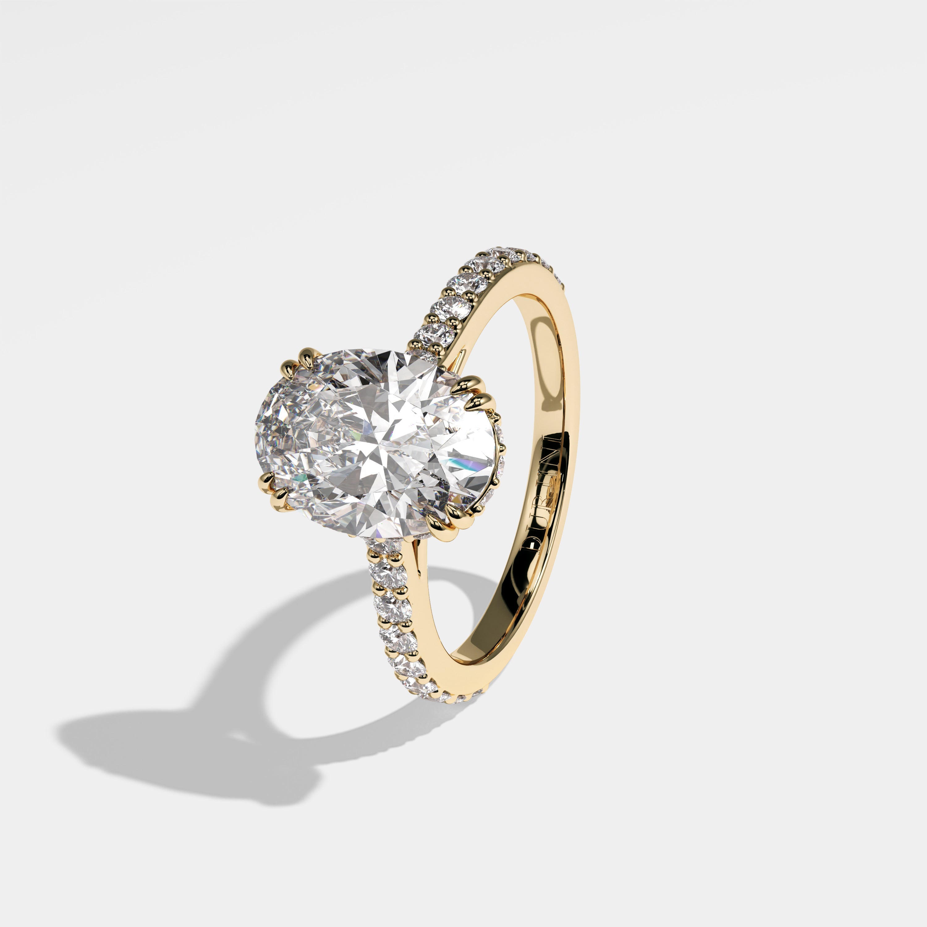 Midnight oval halo diamond engagement ring in 18K yellow gold by Kurbãni Durjini, left view