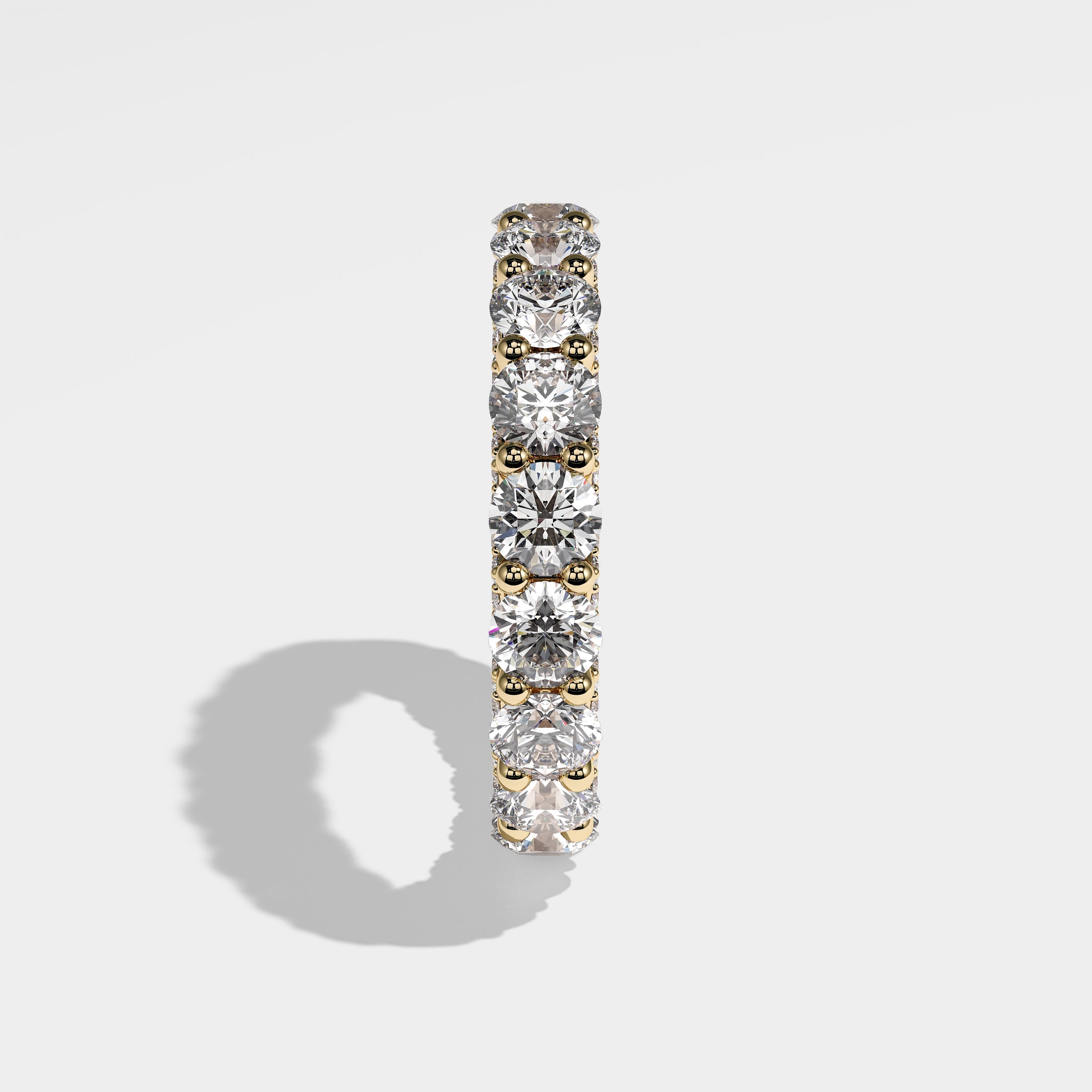 Loyalty round brilliant eternity diamond engagement ring in 18K yellow gold by Kurbãni Durjini, side view