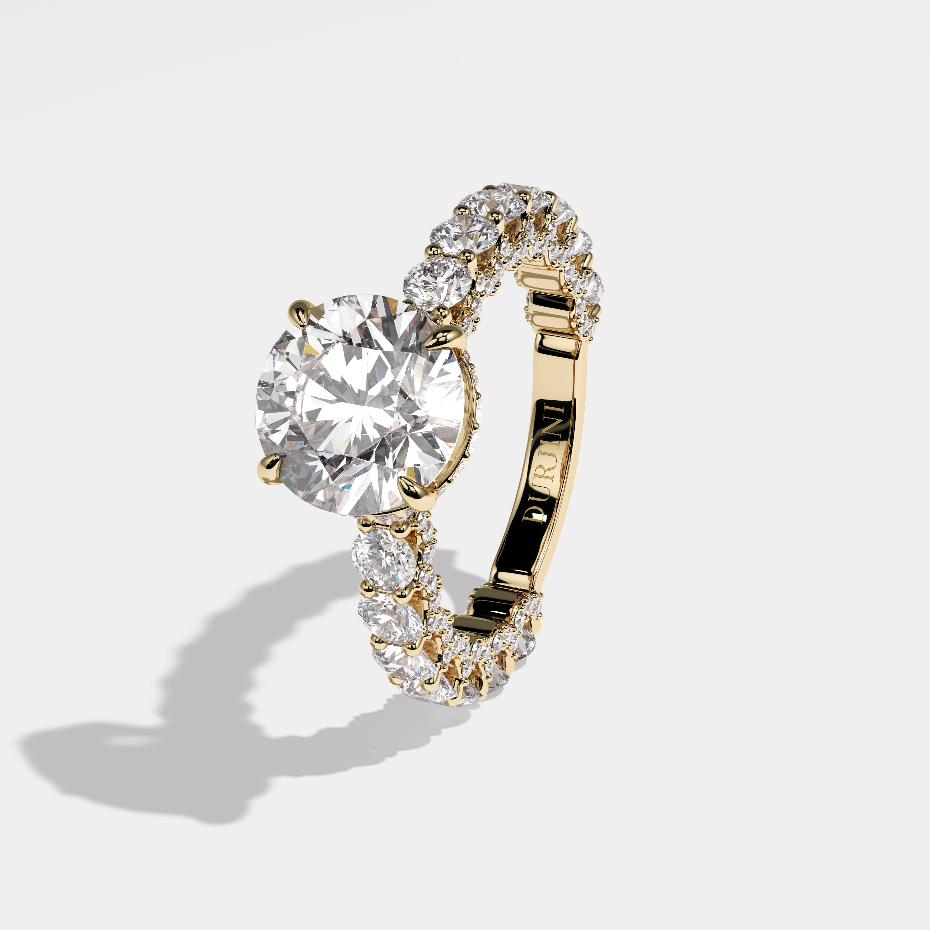 Mayor round brilliant halo diamond engagement ring in 18K yellow gold by Kurbãni Durjini, left view