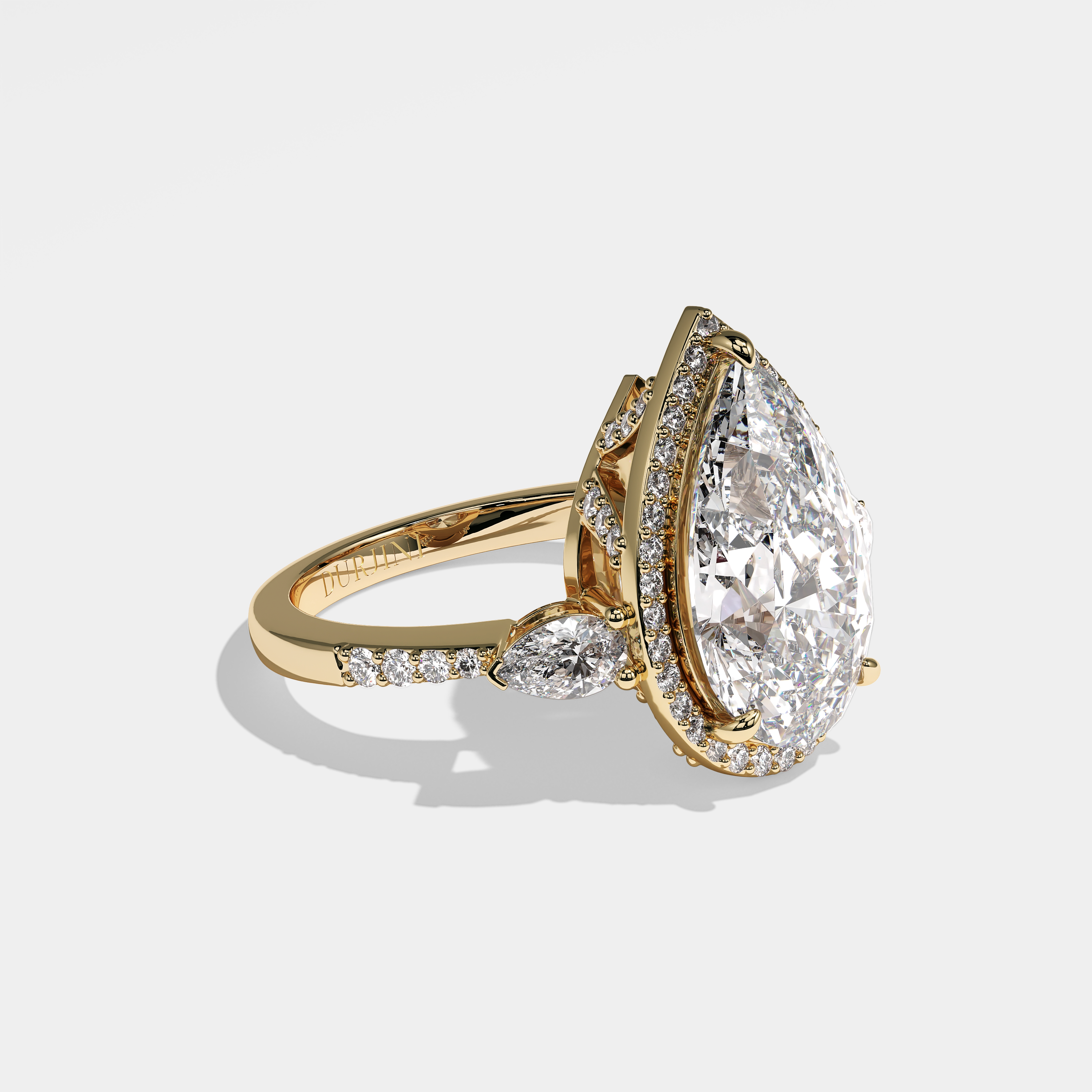 Sienna pear halo diamond engagement ring in 18K yellow gold by Kurbãni Durjini, right view