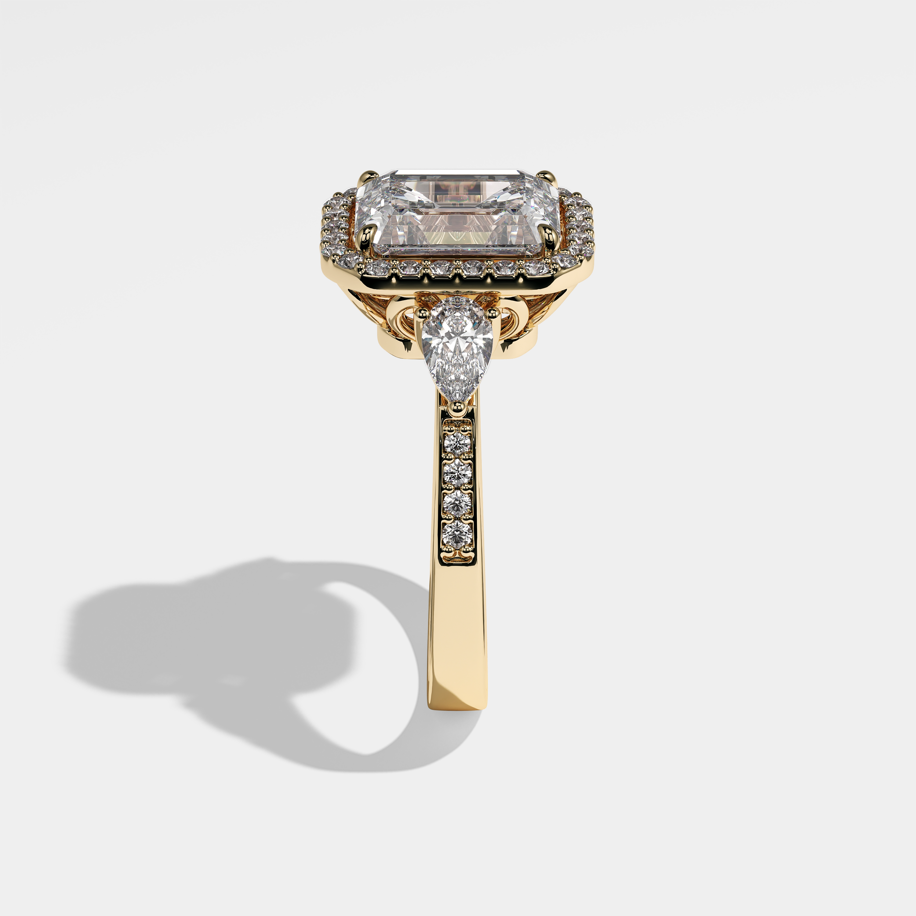 Atlas emerald-cut diamond engagement ring in 18K yellow gold by Kurbãni Durjini, side view