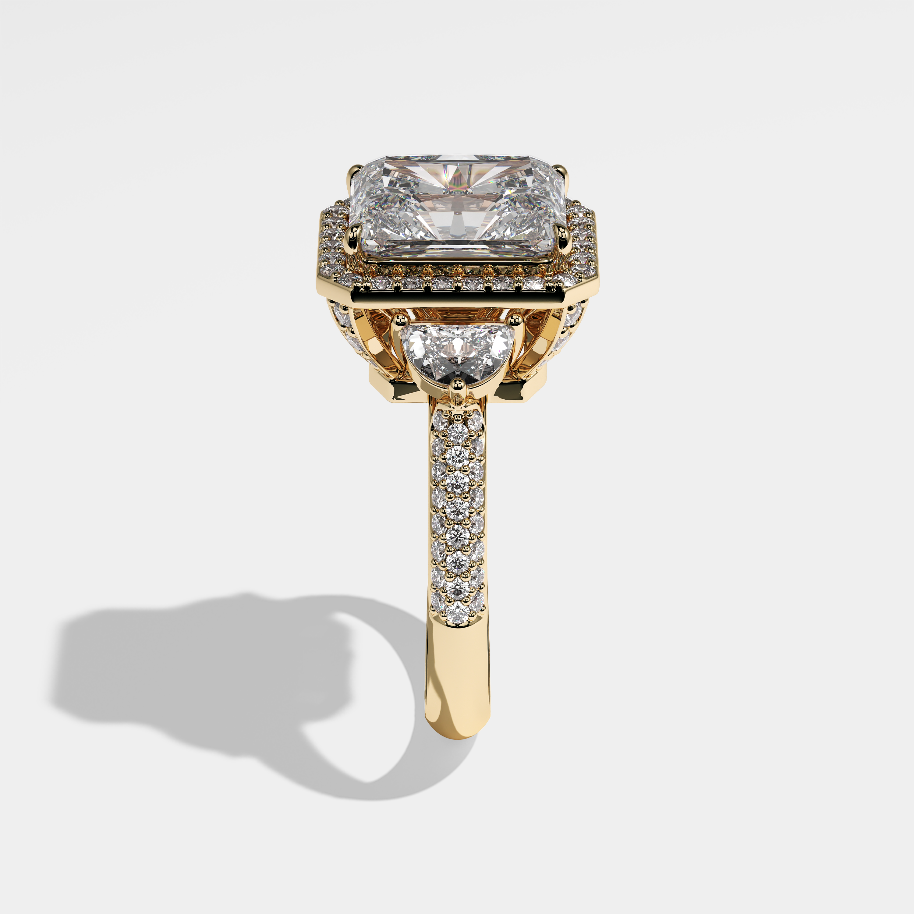 Dhalia radiant halo diamond engagement ring in 18K yellow gold by Kurbãni Durjini, side view