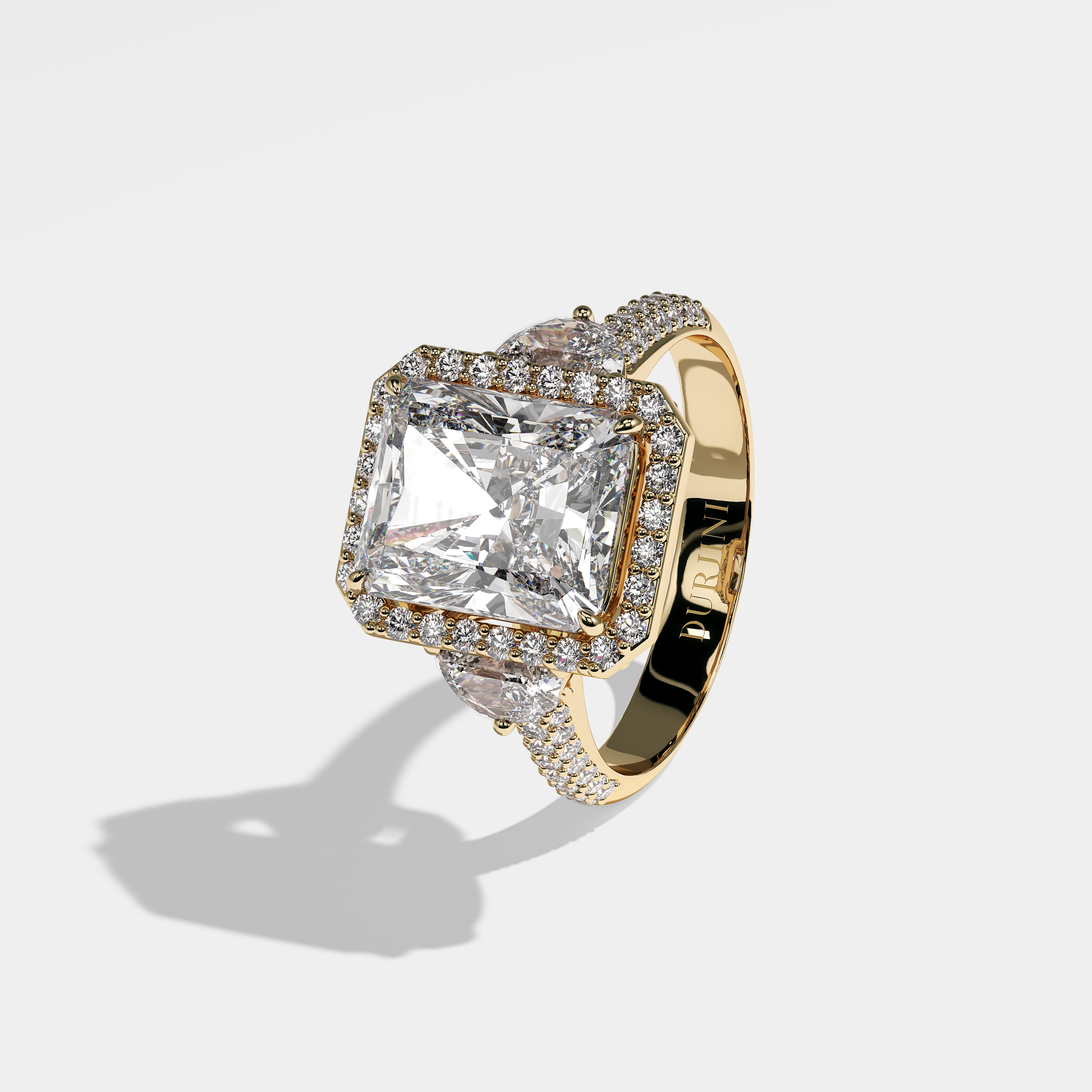 Dhalia radiant halo diamond engagement ring in 18K yellow gold by Kurbãni Durjini, left view