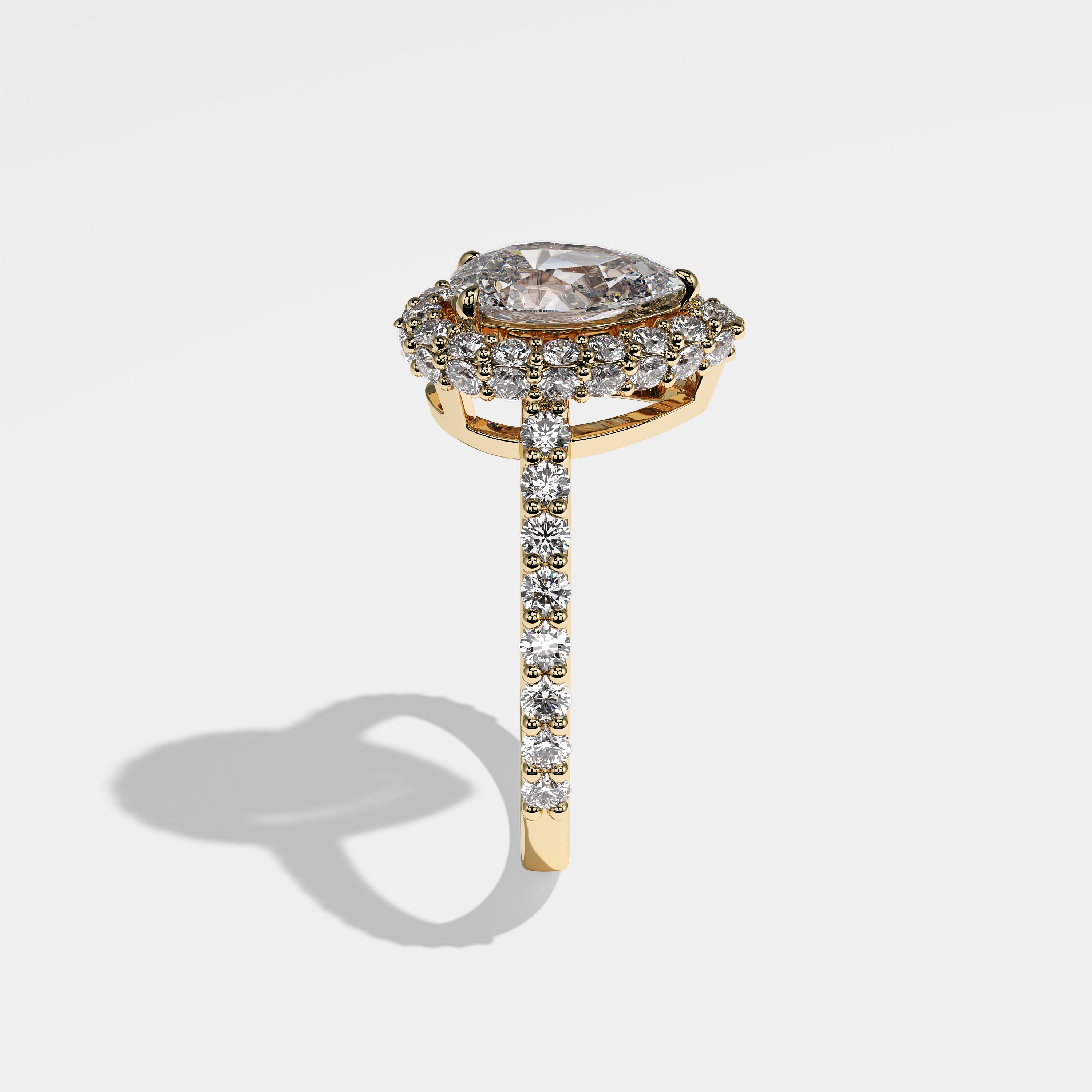 Cecilia pear halo diamond engagement ring in 18K yellow gold by Kurbãni Durjini, side view
