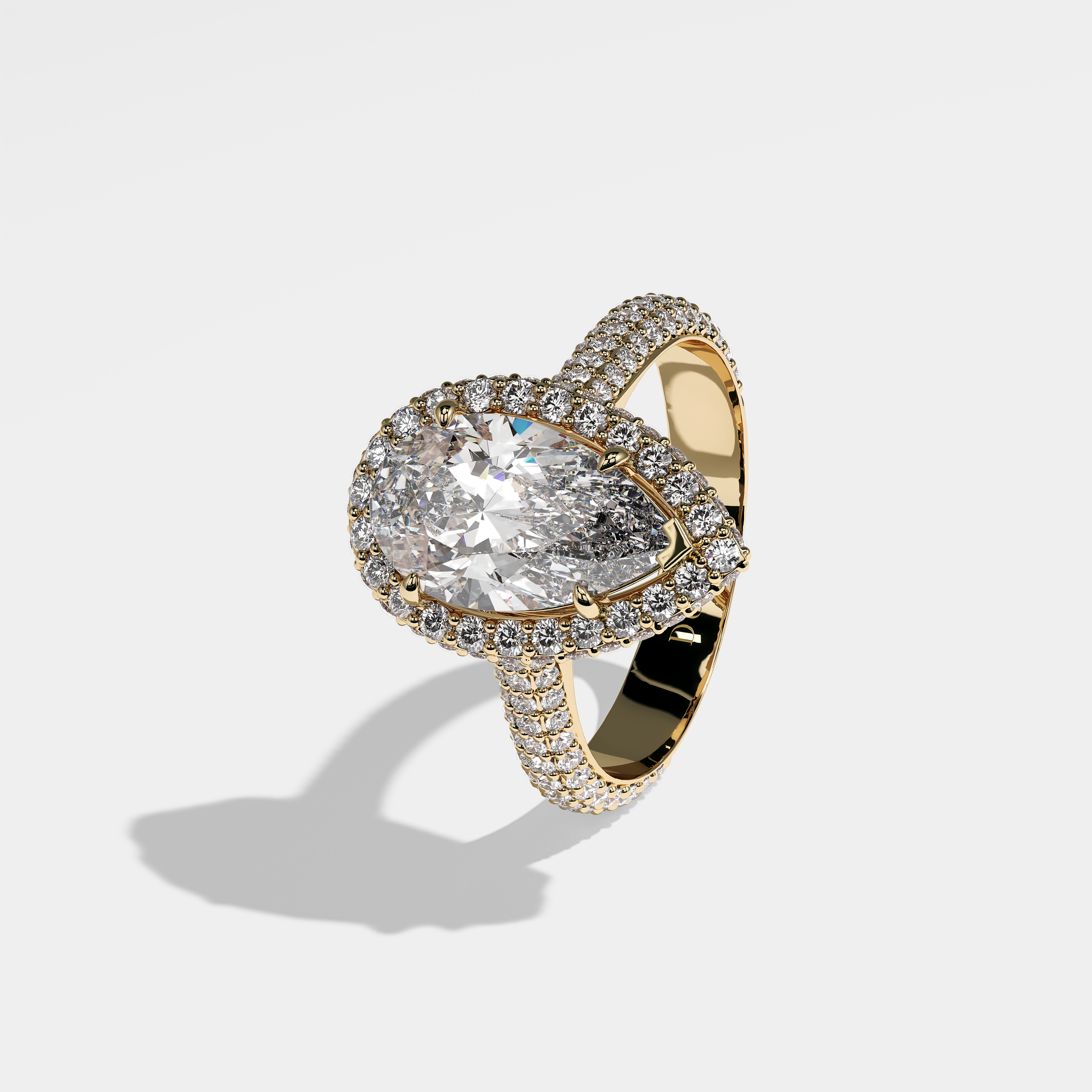 Norma pear halo diamond engagement ring in 18K yellow gold by Kurbãni Durjini, left view
