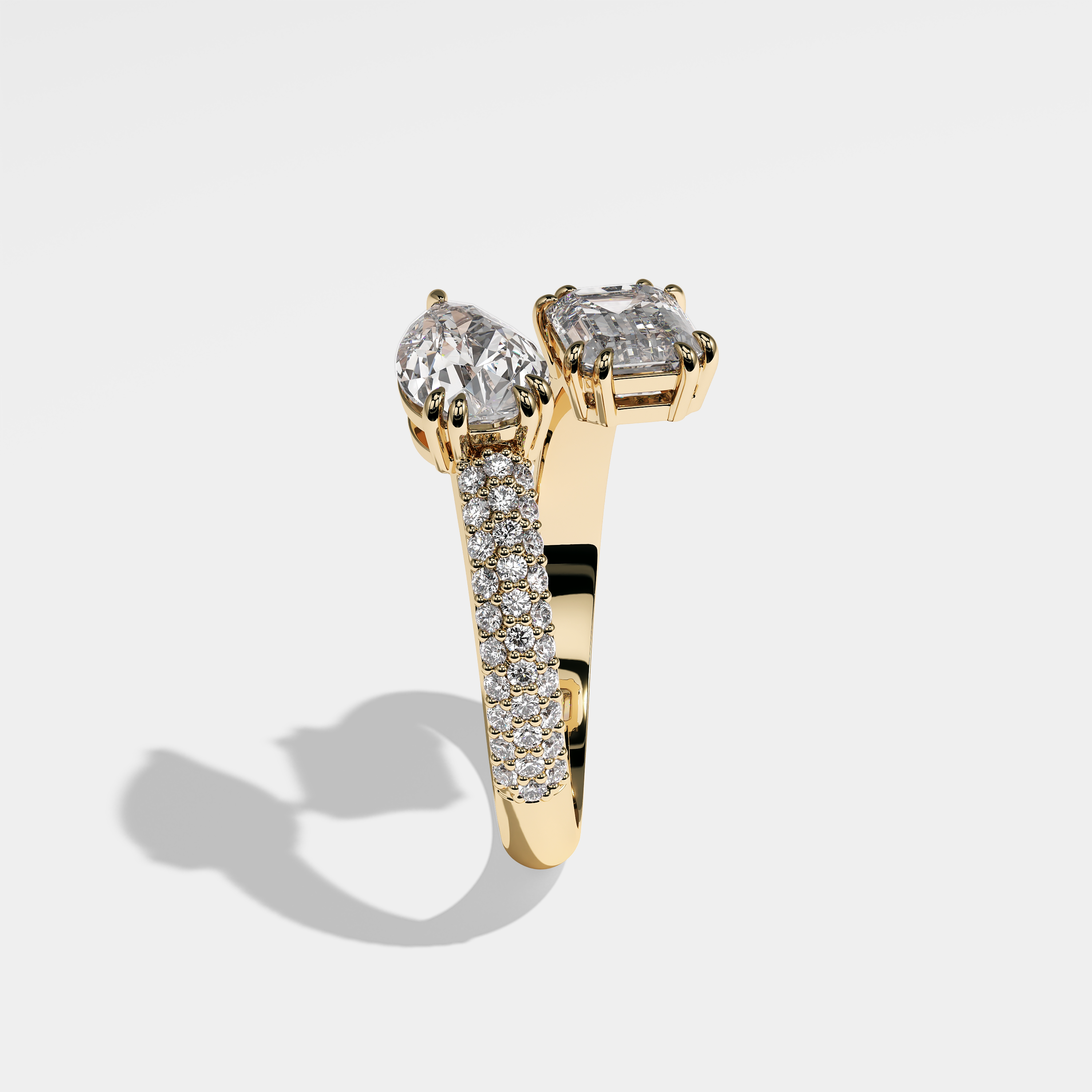Mystery pear diamond engagement ring in 18K yellow gold by Kurbãni Durjini, side view