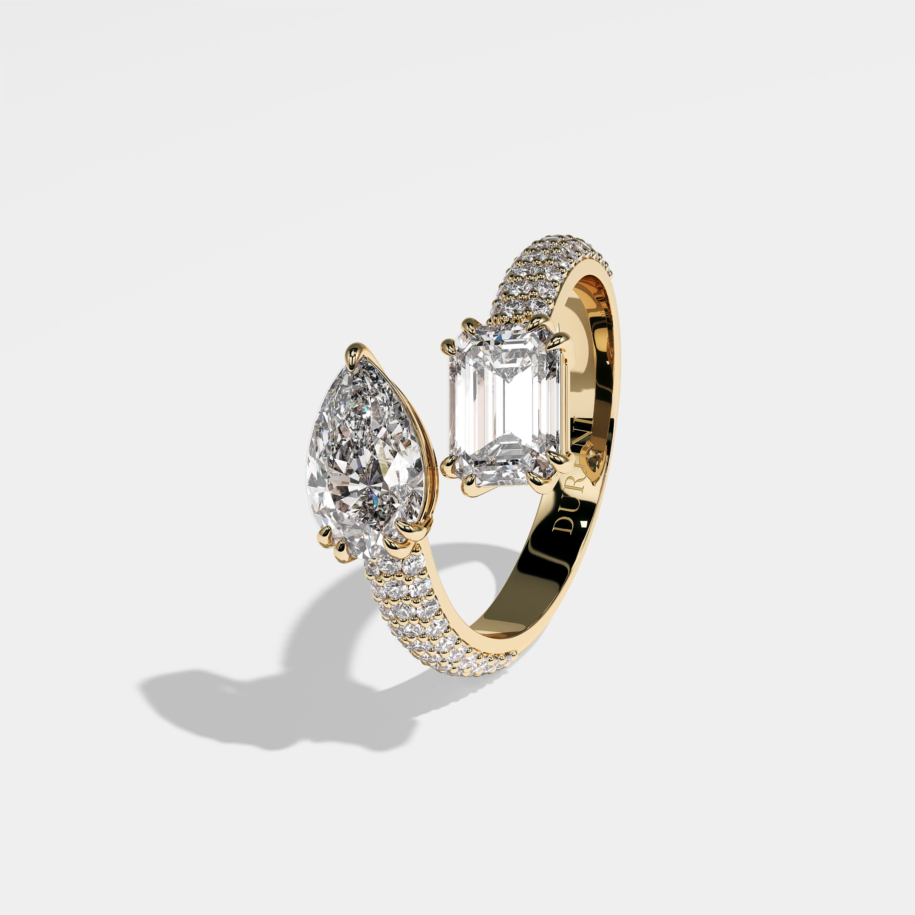 Mystery pear diamond engagement ring in 18K yellow gold by Kurbãni Durjini, left view