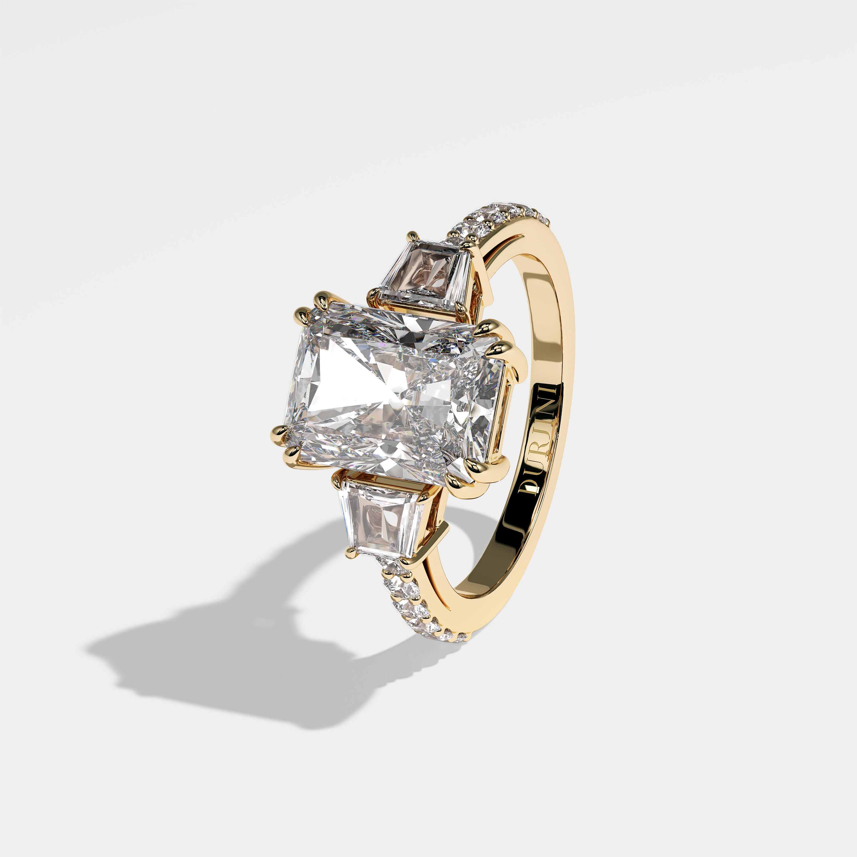 Charlie radiant halo diamond engagement ring in 18K yellow gold by Kurbãni Durjini, left view