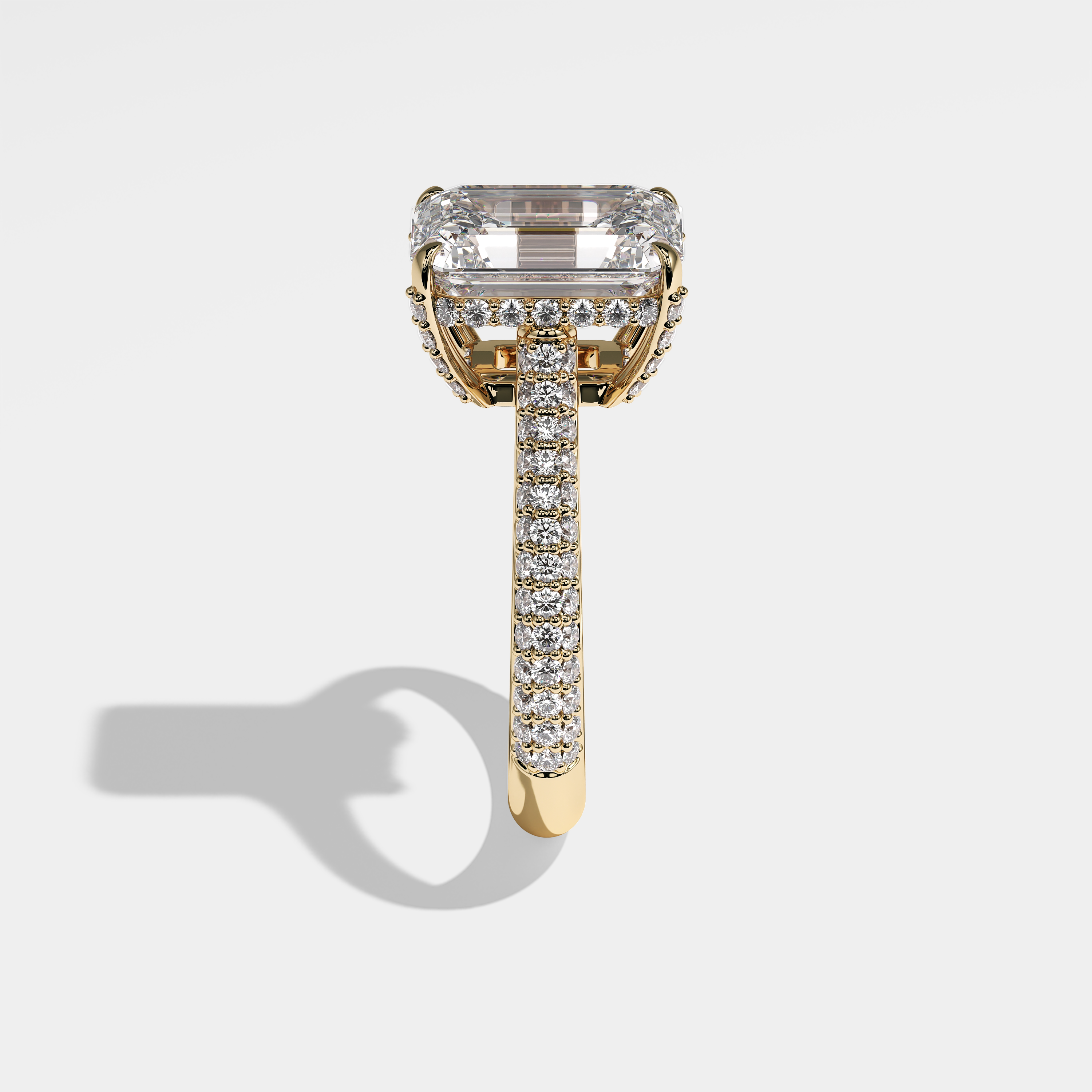 Katy emerald halo diamond engagement ring in 18K yellow gold by Kurbãni Durjini, side view