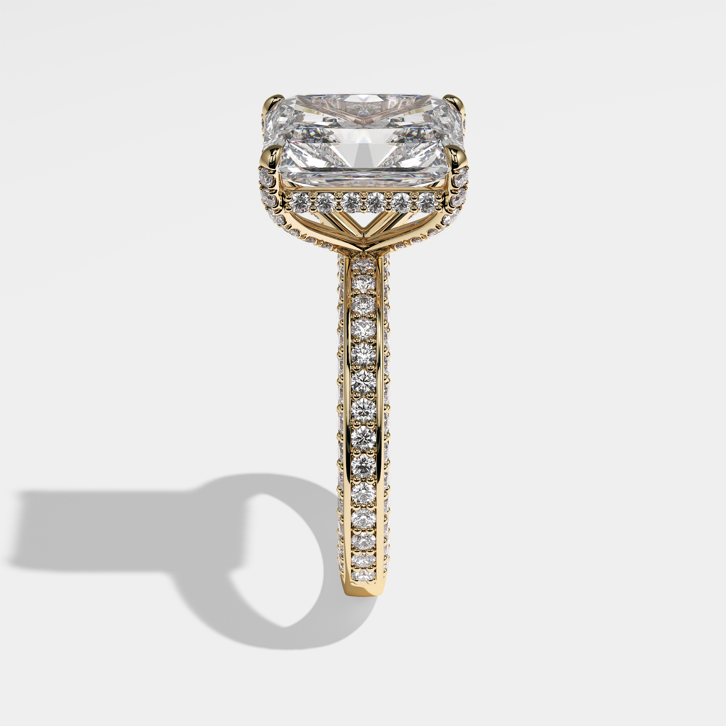 Constance radiant halo diamond engagement ring in 18K yellow gold by Kurbãni Durjini, side view
