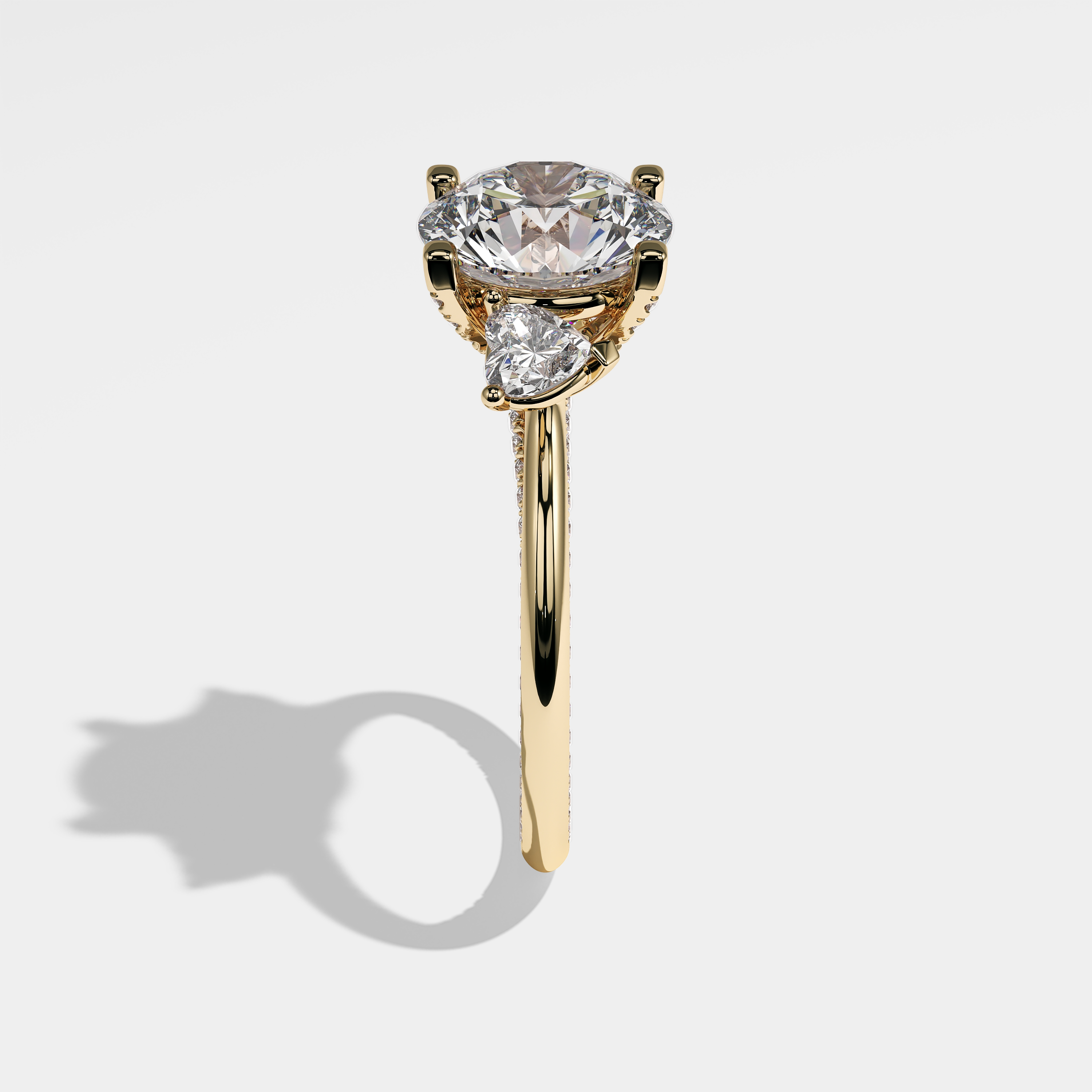 Mariana round brilliant diamond engagement ring in 18K yellow gold by Kurbãni Durjini, side view