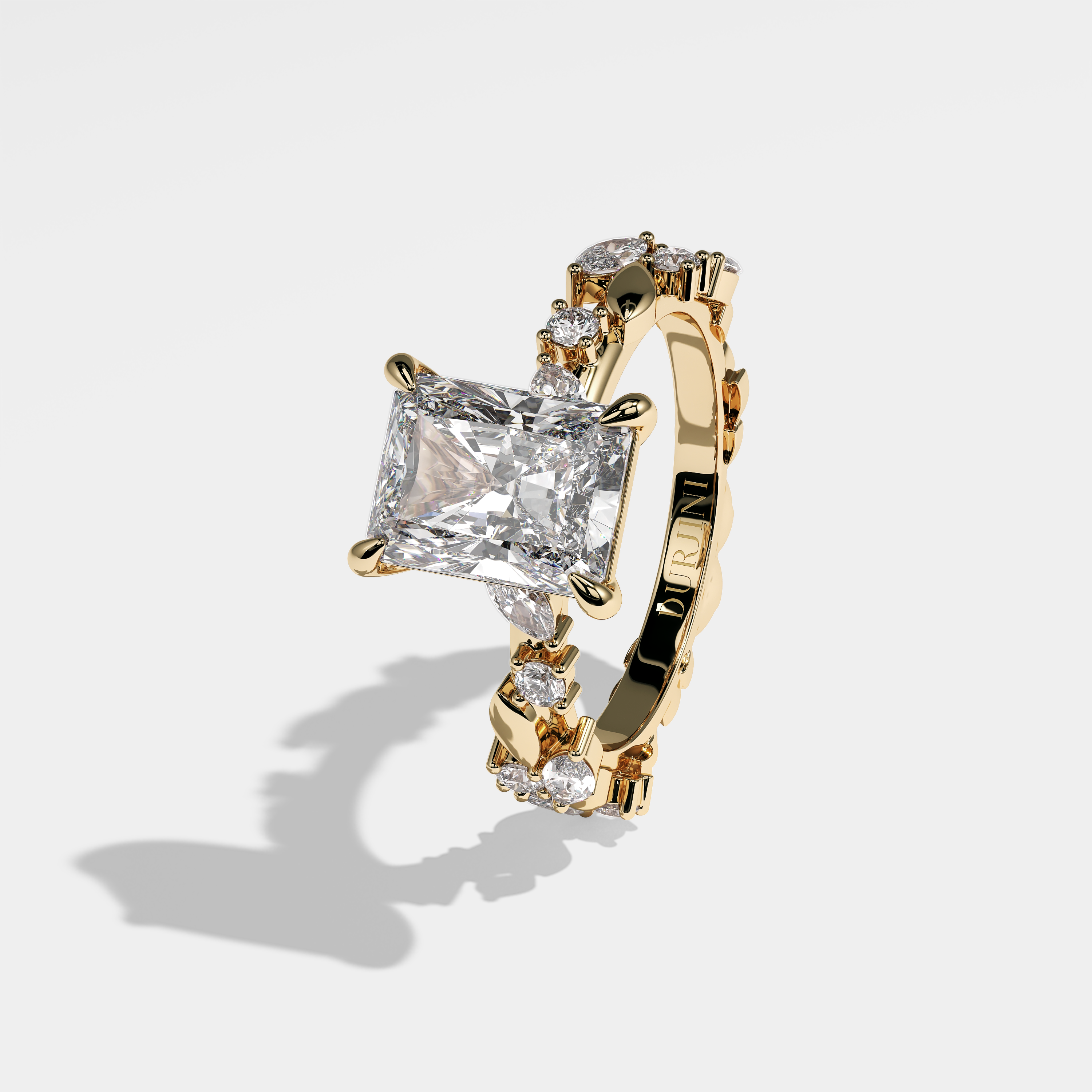 Left View – Kurbãni Durjini Mackenna Diamond Radiant Engagement Ring Yellow Gold