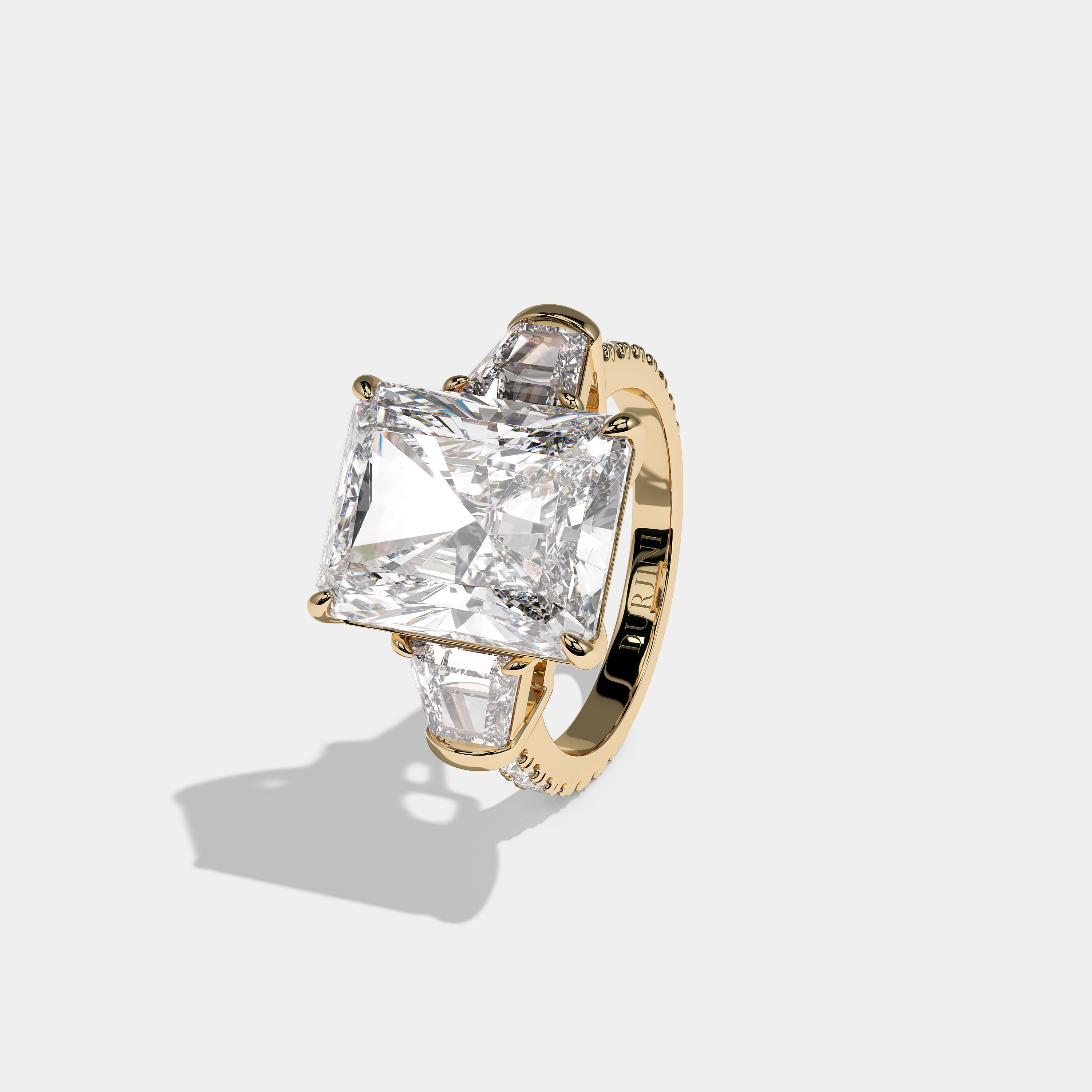 Left View – Kurbãni Durjini Chevalier d’Or Diamond Radiant Halo Engagement Ring Yellow Gold