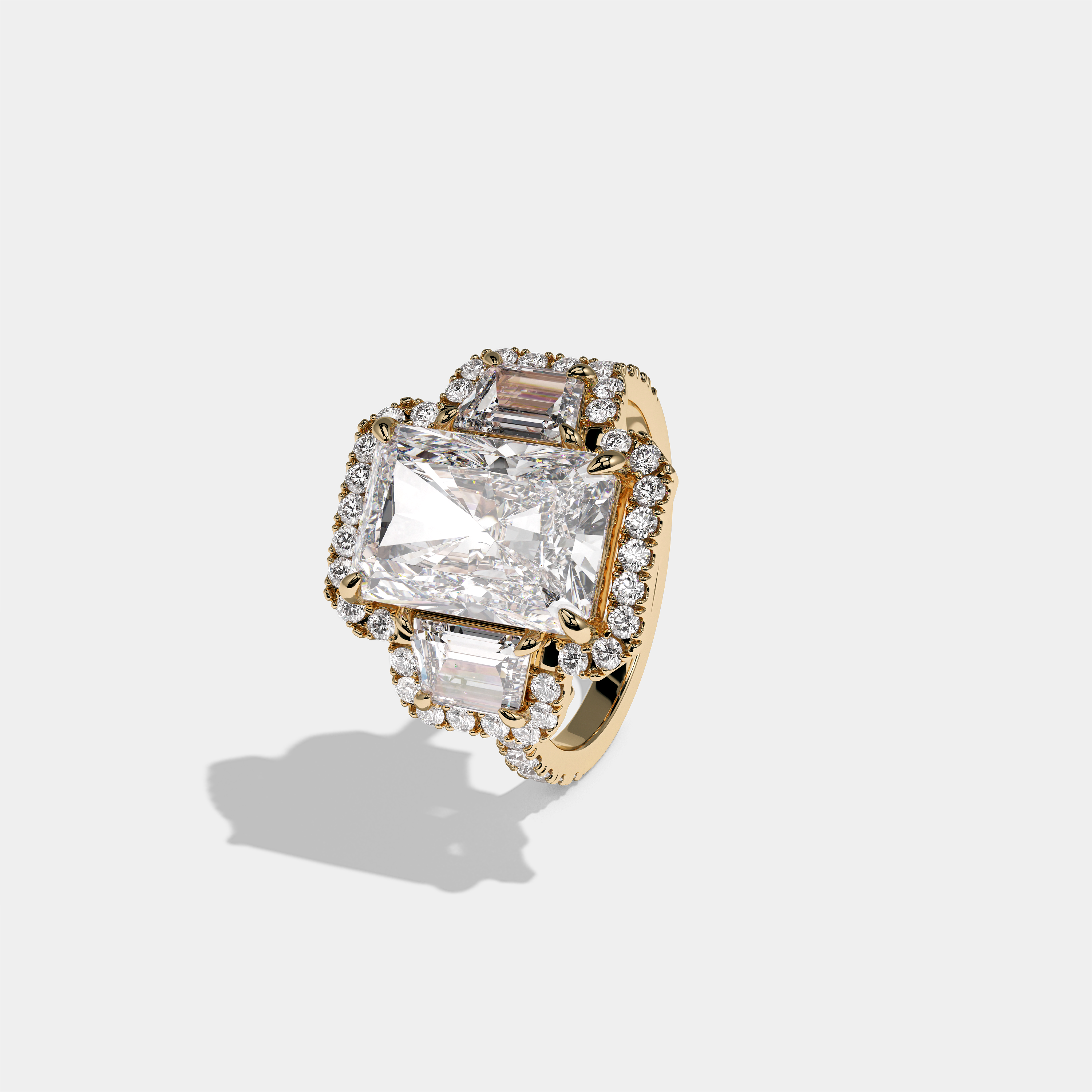 Constance Duchess radiant halo diamond engagement ring in 18K yellow gold by Kurbãni Durjini, left view