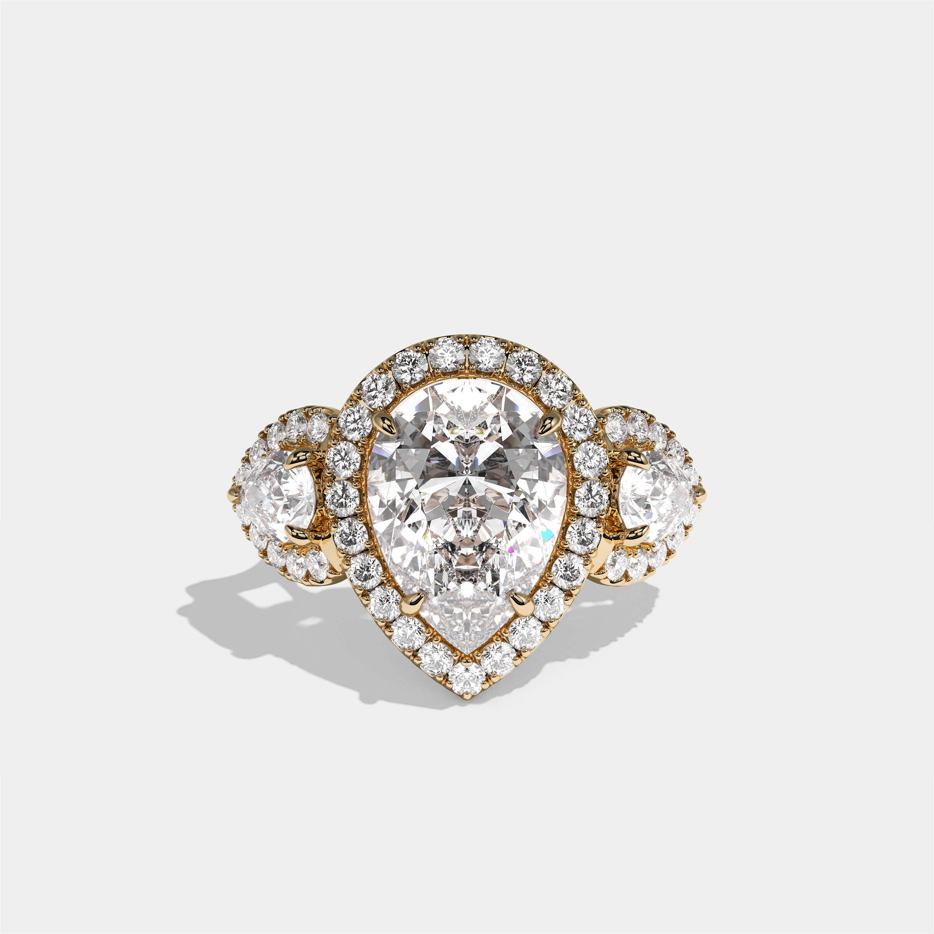 Dorothea Duchess diamond pear halo engagement ring in 18K yellow gold by Kurbãni Durjini, front view