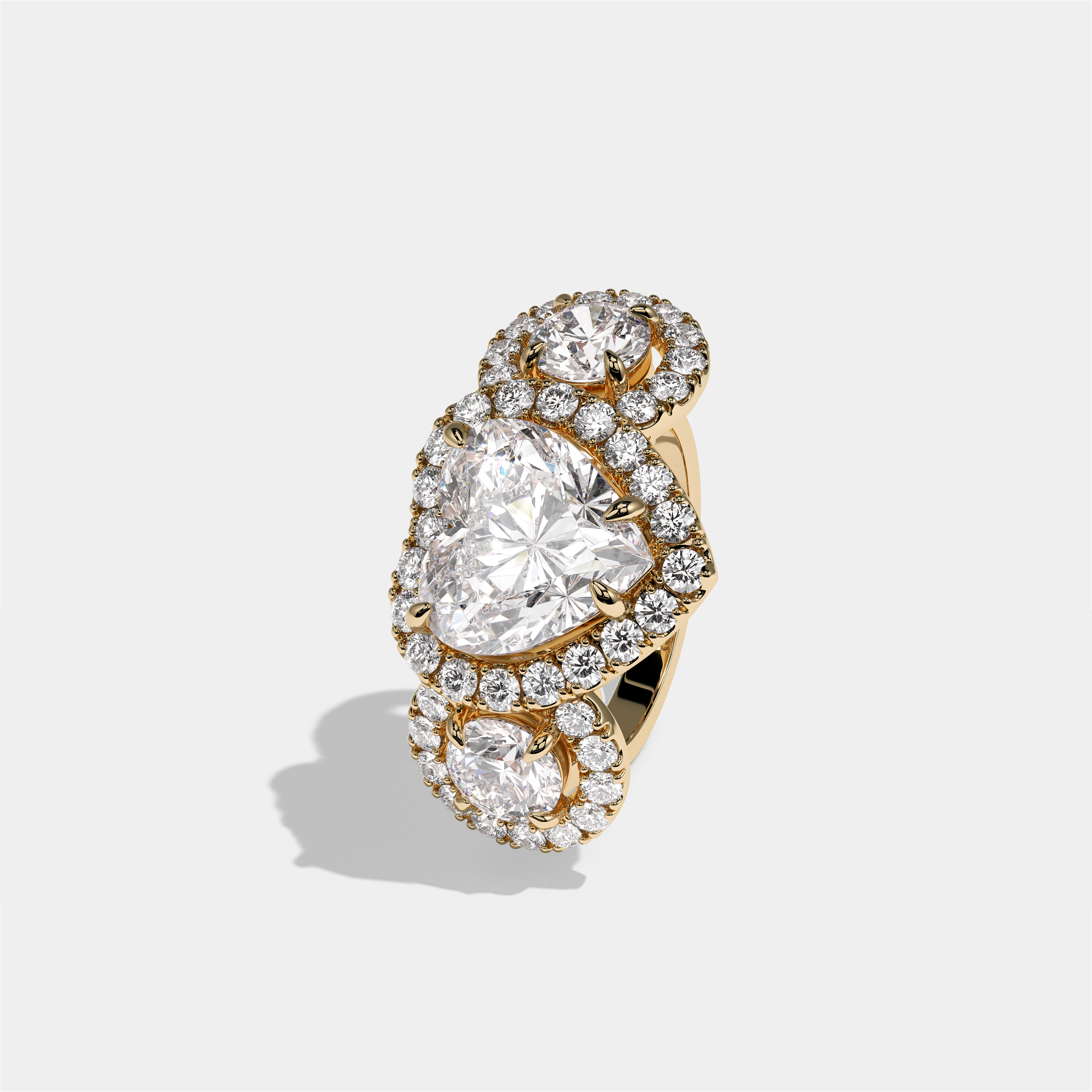 Blanche Countess heart halo diamond engagement ring in 18K yellow gold by Kurbãni Durjini, left view