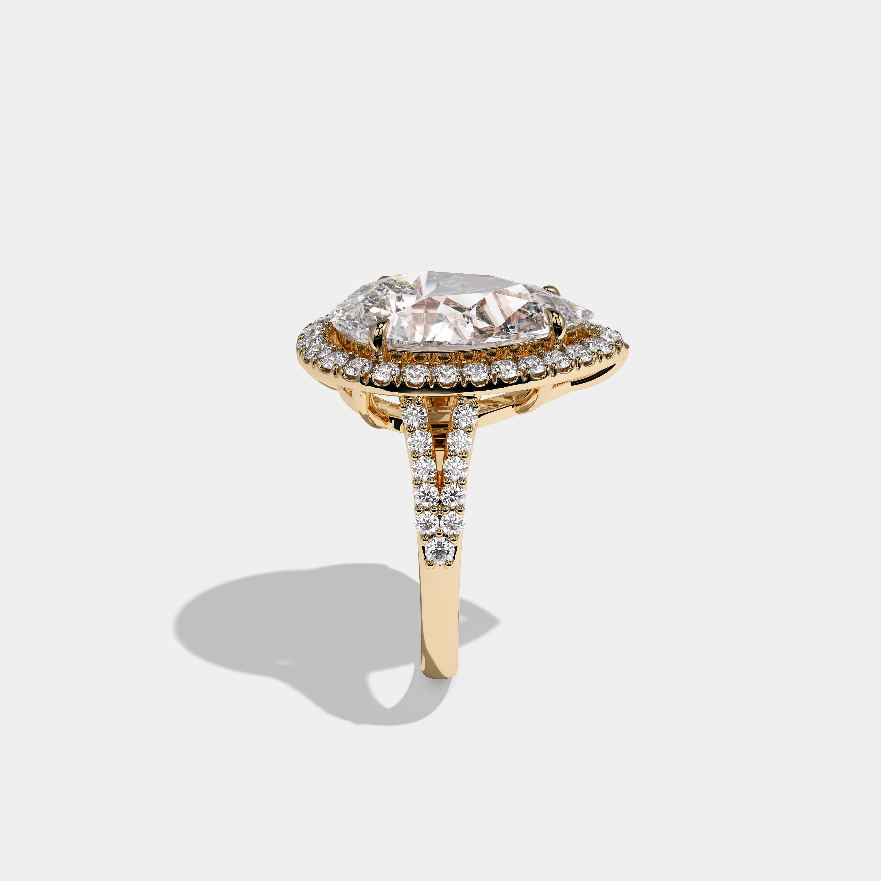 Helena Viscountess diamond pear halo engagement ring in 18K yellow gold by Kurbãni Durjini, side view