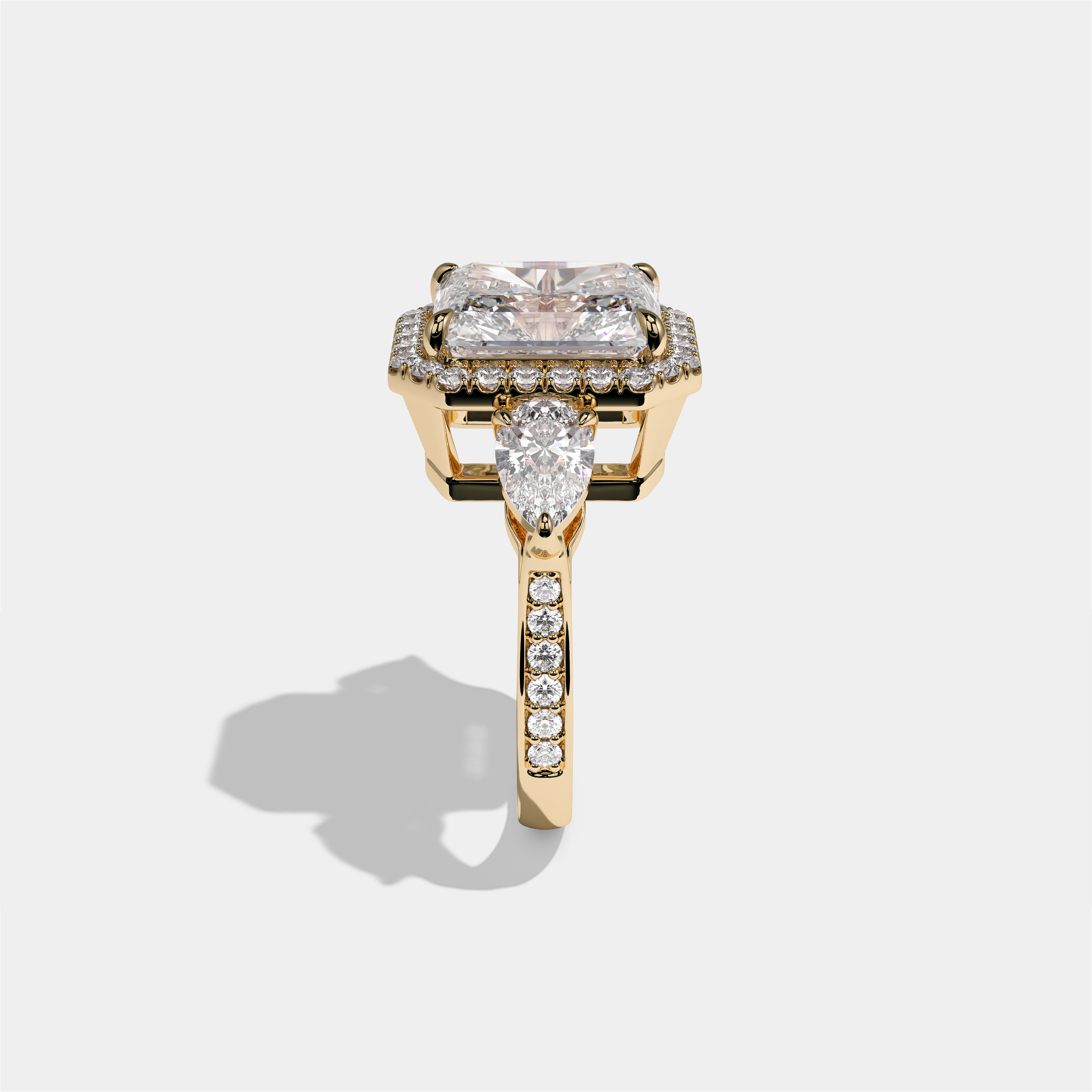 Marian Viscountess Letitia diamond radiant halo engagement ring in 18K yellow gold by Kurbãni Durjini, side view