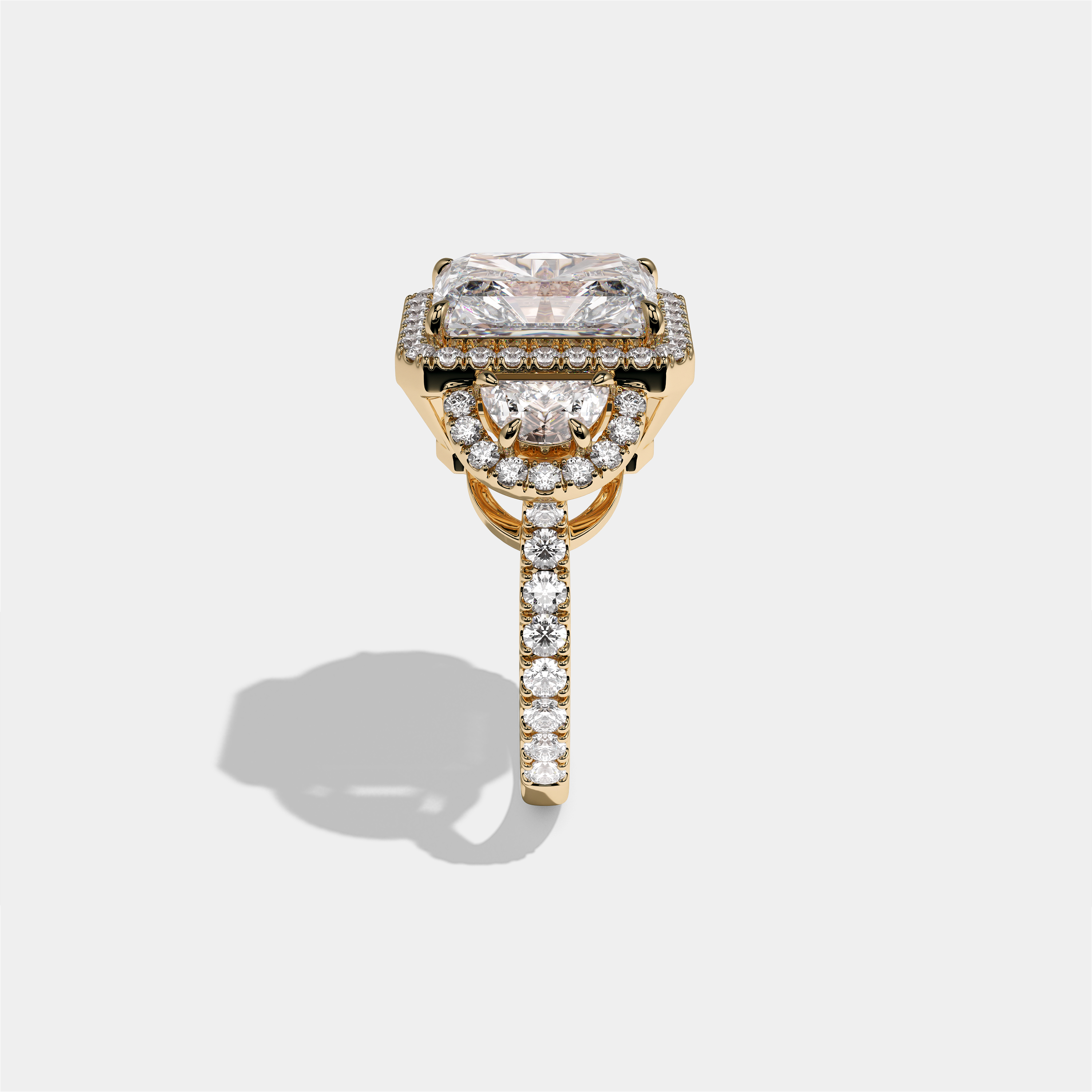 Aveline Lady Godiva diamond radiant halo engagement ring in 18K yellow gold by Kurbãni Durjini, side view