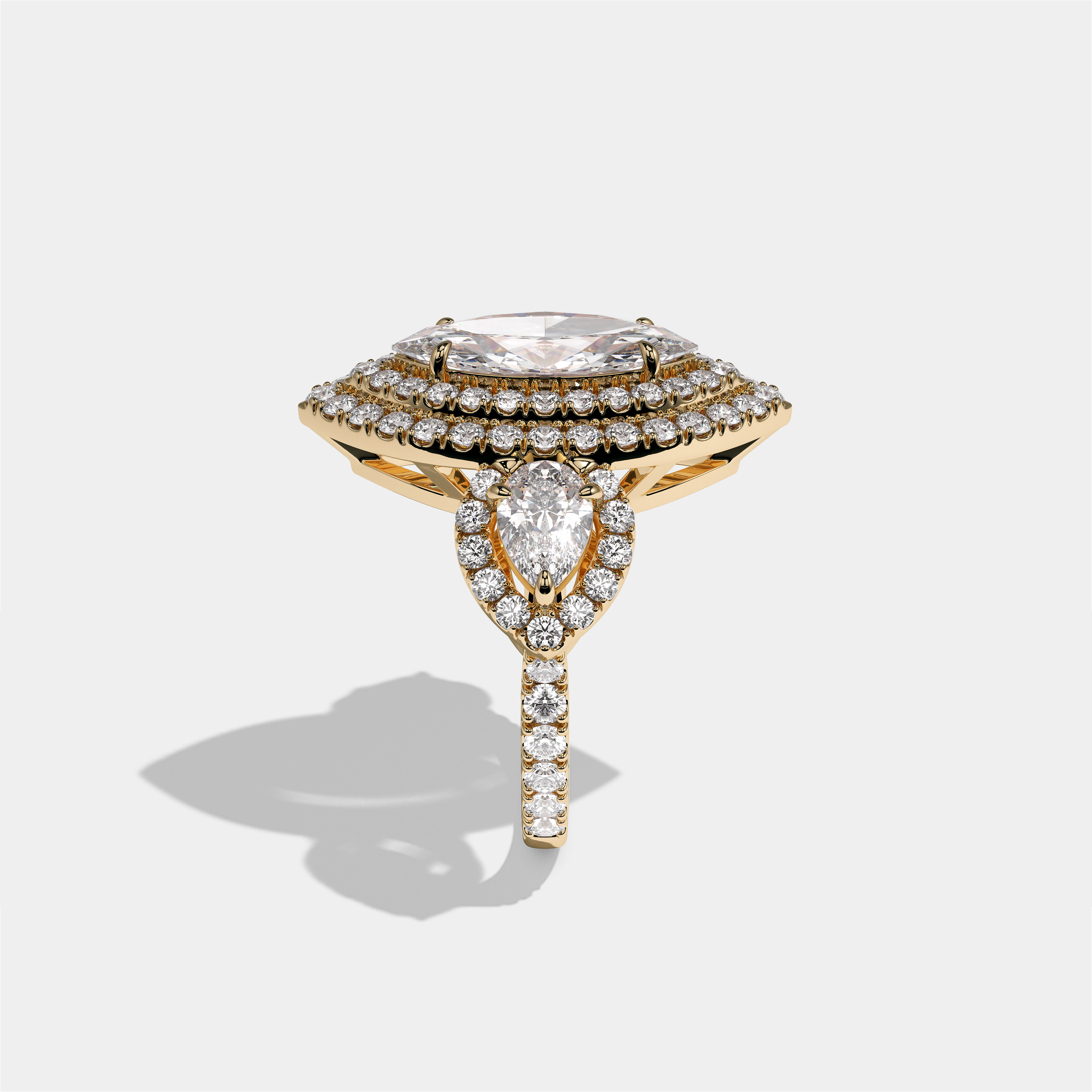 Drusilla Lady Wexford diamond marquise halo engagement ring in 18K yellow gold by Kurbãni Durjini, side view