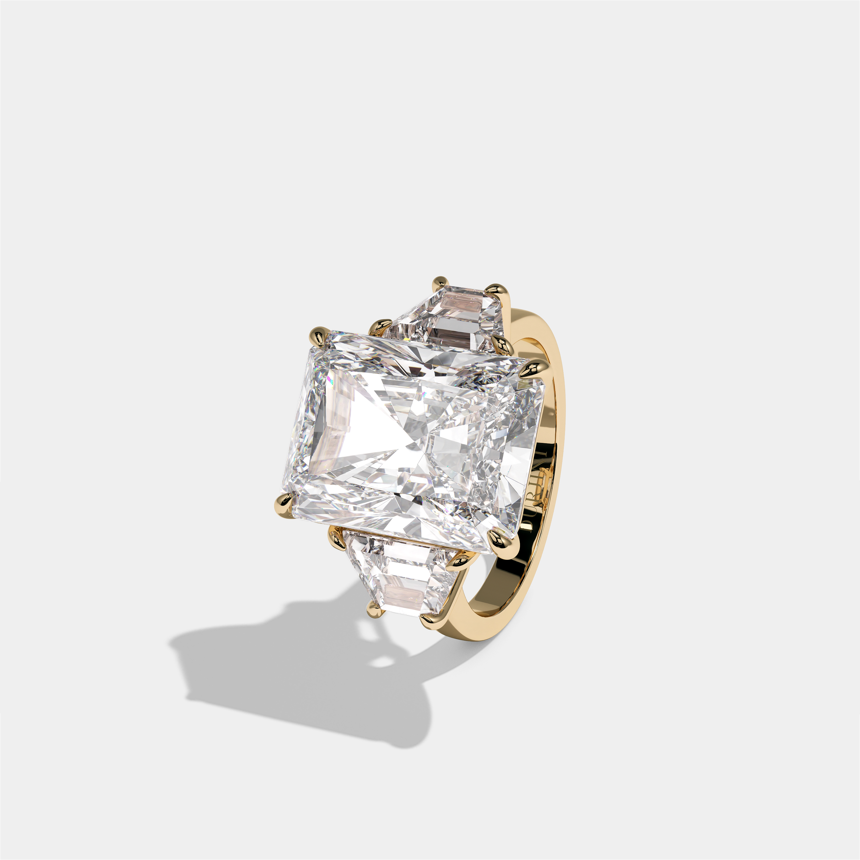 Shira Lady Kingswell diamond radiant halo engagement ring in 18K yellow gold by Kurbãni Durjini, left view