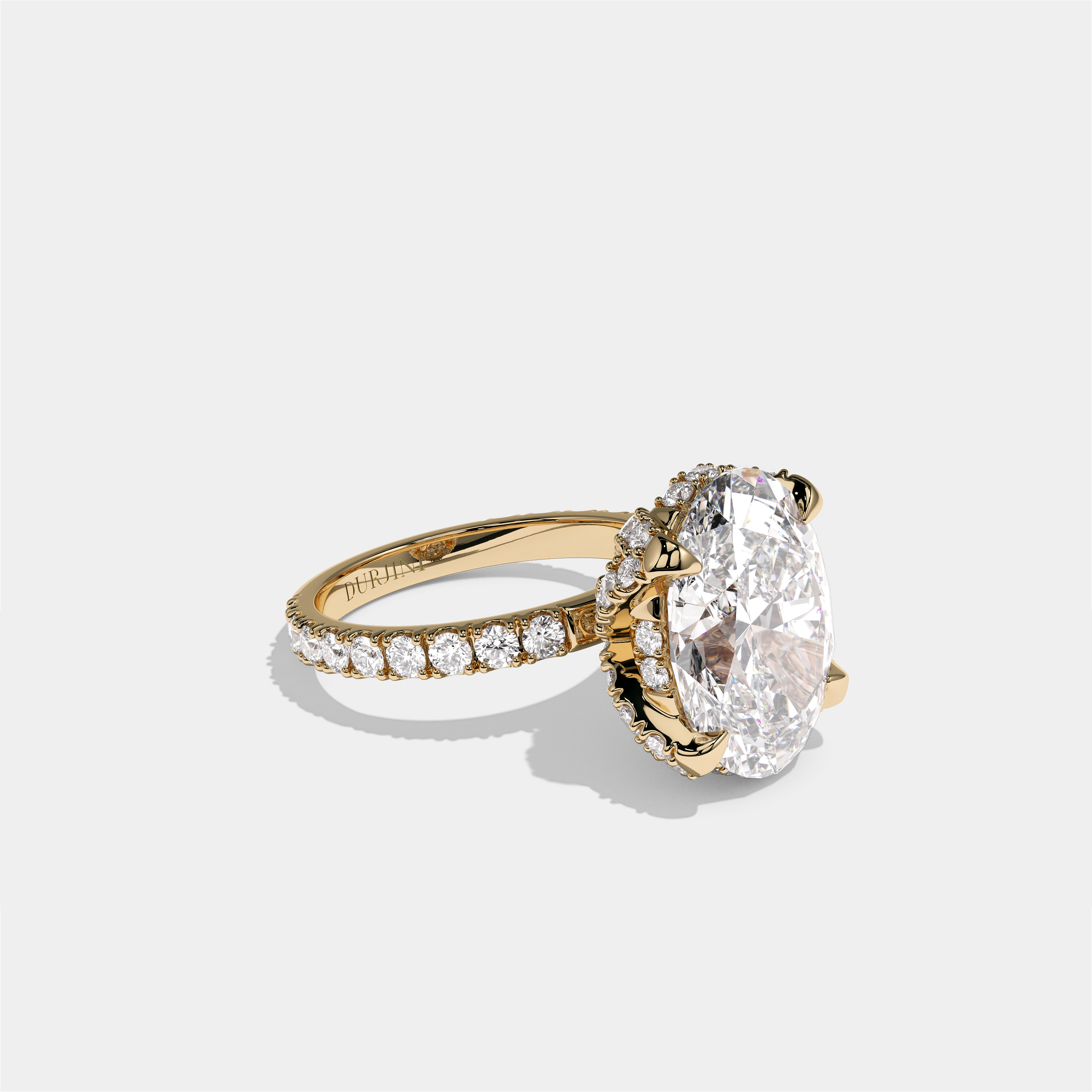 Rebecca Lady Ainsworth diamond oval halo engagement ring in 18K yellow gold by Kurbãni Durjini, right view