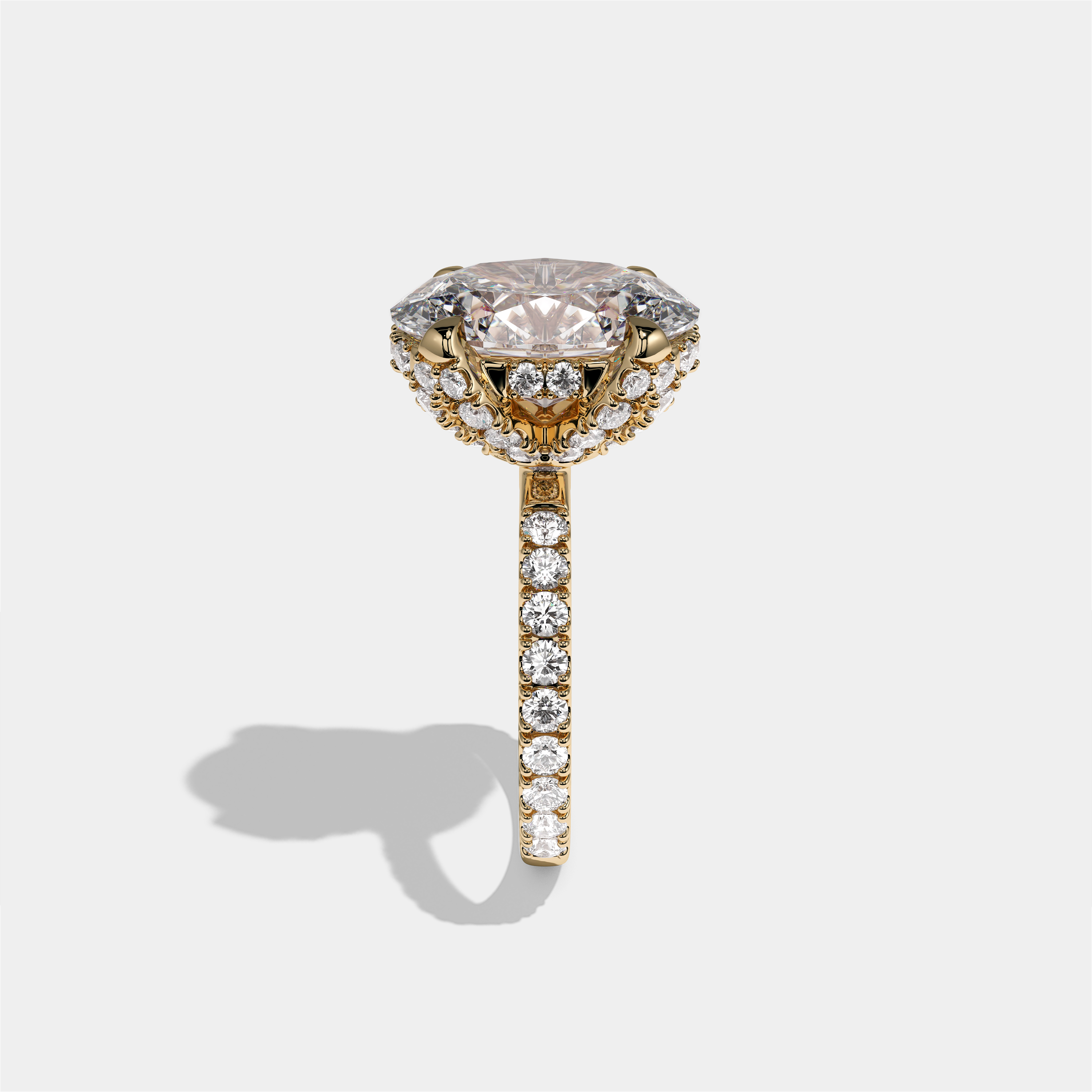 Rebecca Lady Ainsworth diamond oval halo engagement ring in 18K yellow gold by Kurbãni Durjini, side view