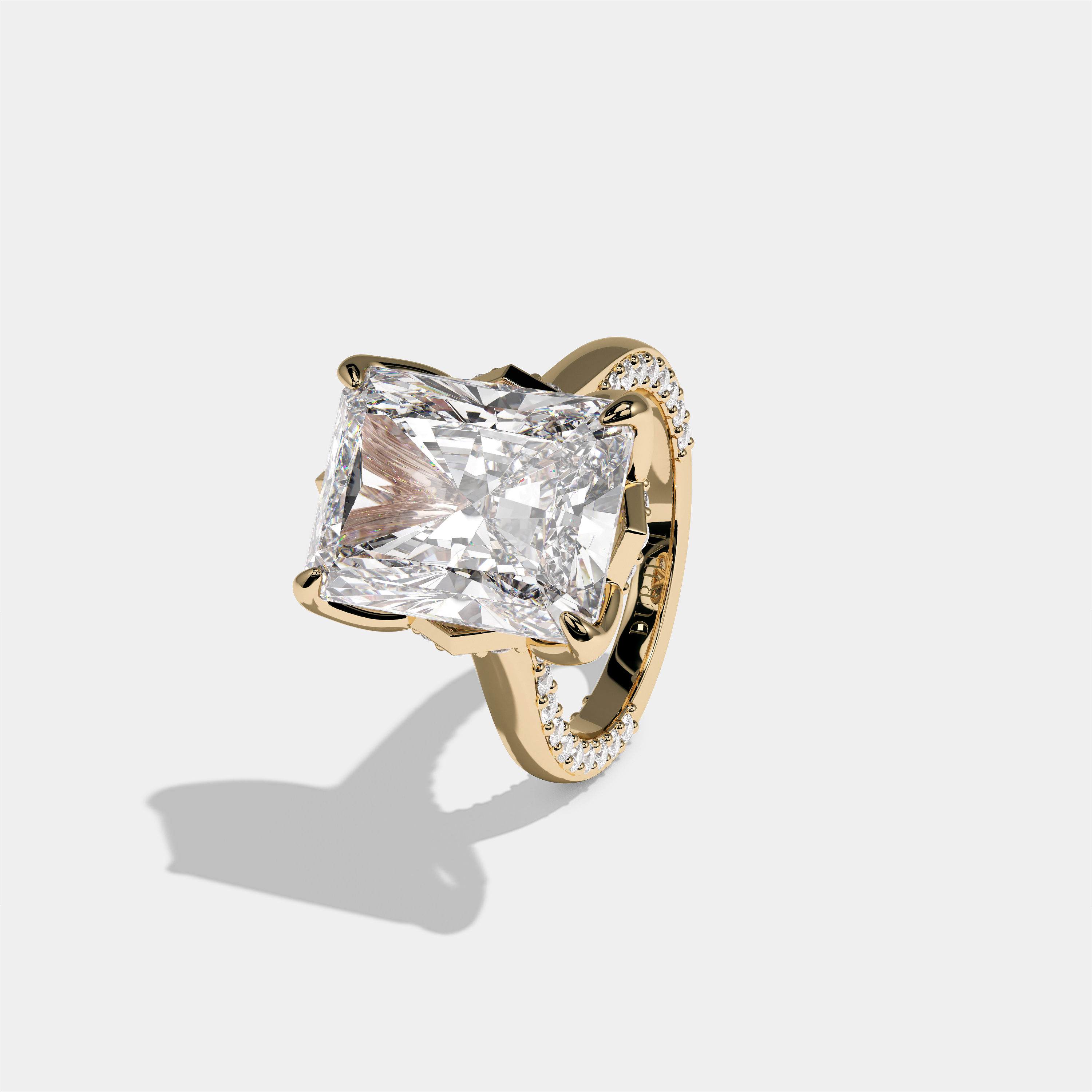 Elisheva Kingswell diamond radiant halo engagement ring in 18K yellow gold by Kurbãni Durjini, left view