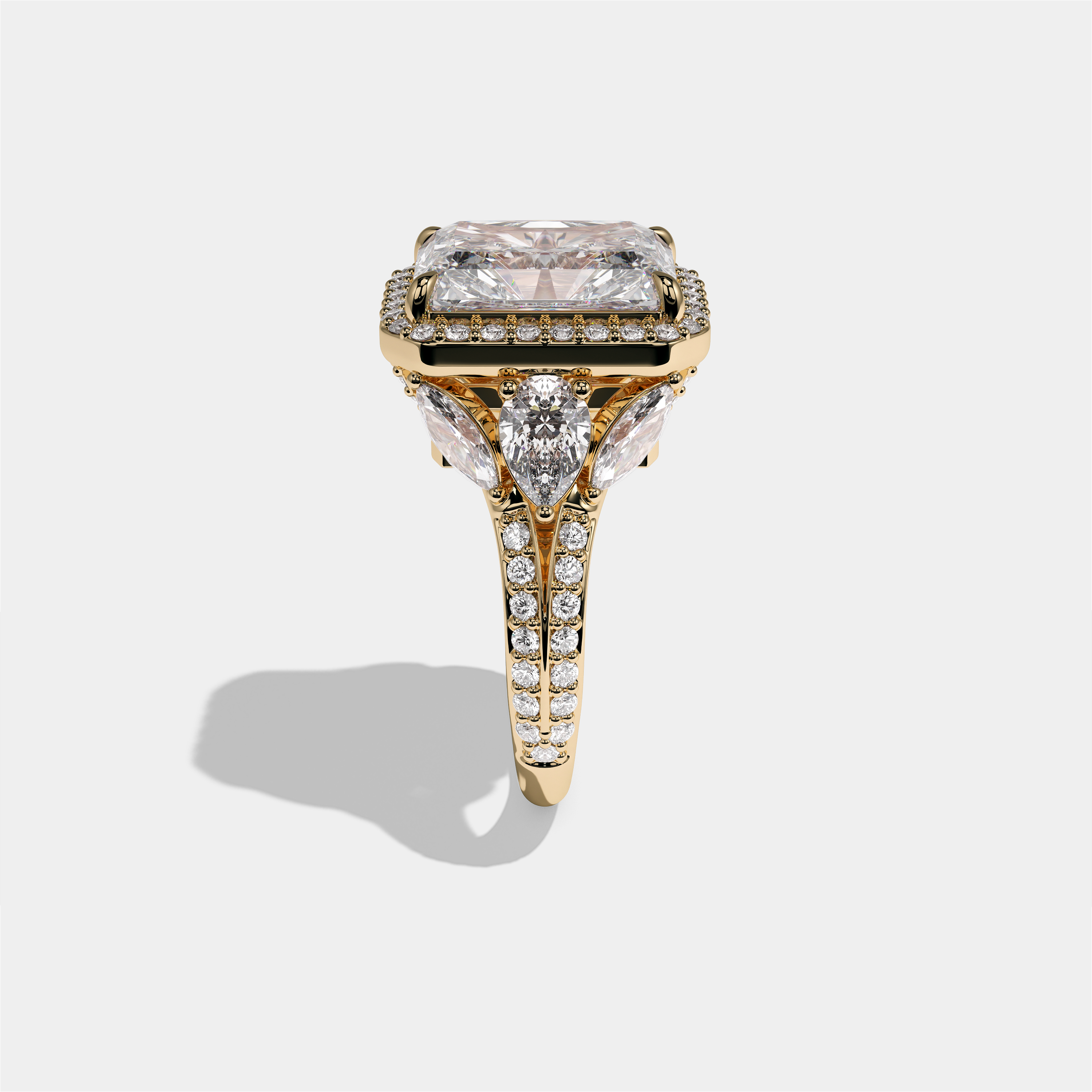 Rina Eclat Ashbourne diamond radiant halo engagement ring in 18K yellow gold by Kurbãni Durjini, side view