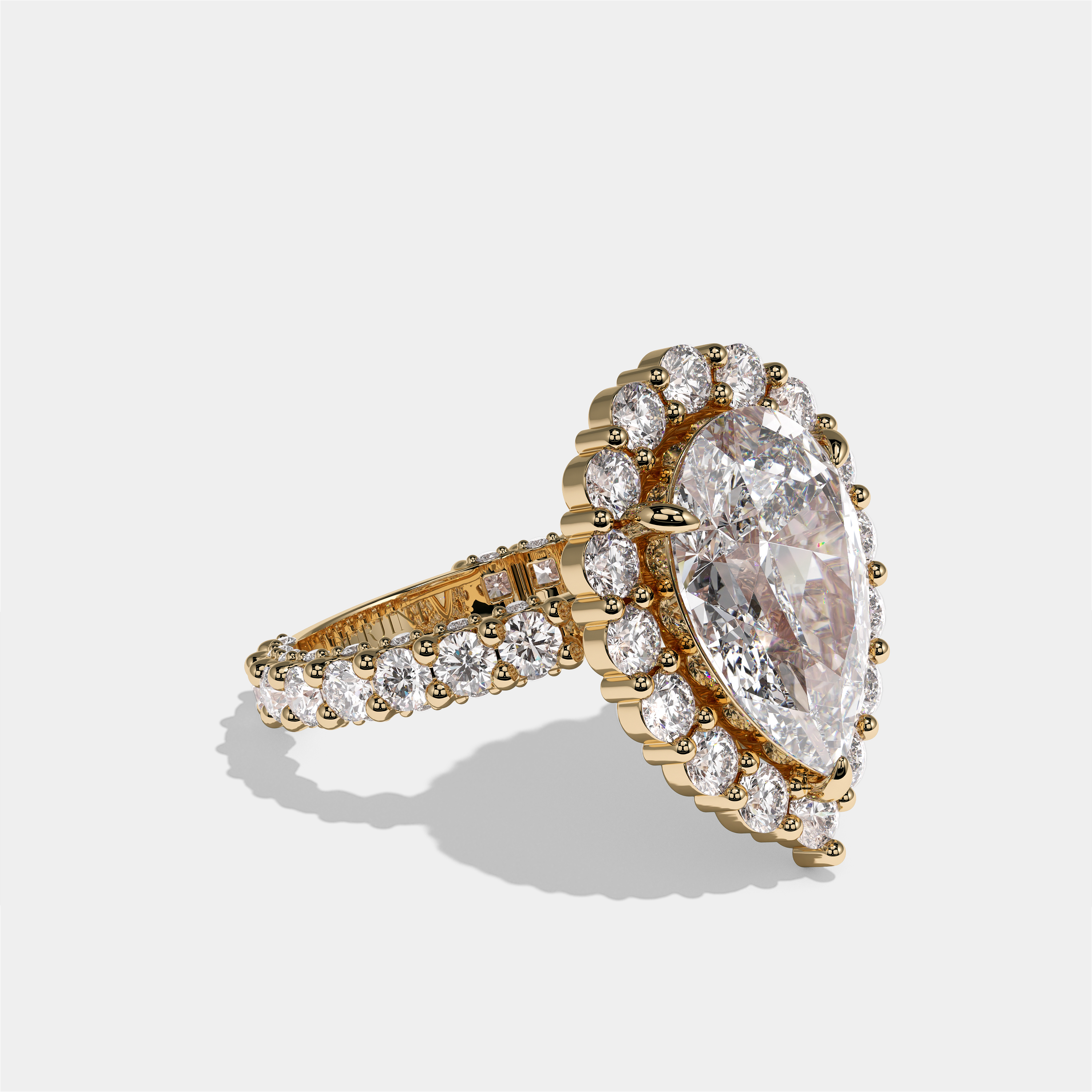 Judith Fairbourne diamond pear halo engagement ring in 18K yellow gold by Kurbãni Durjini, right view