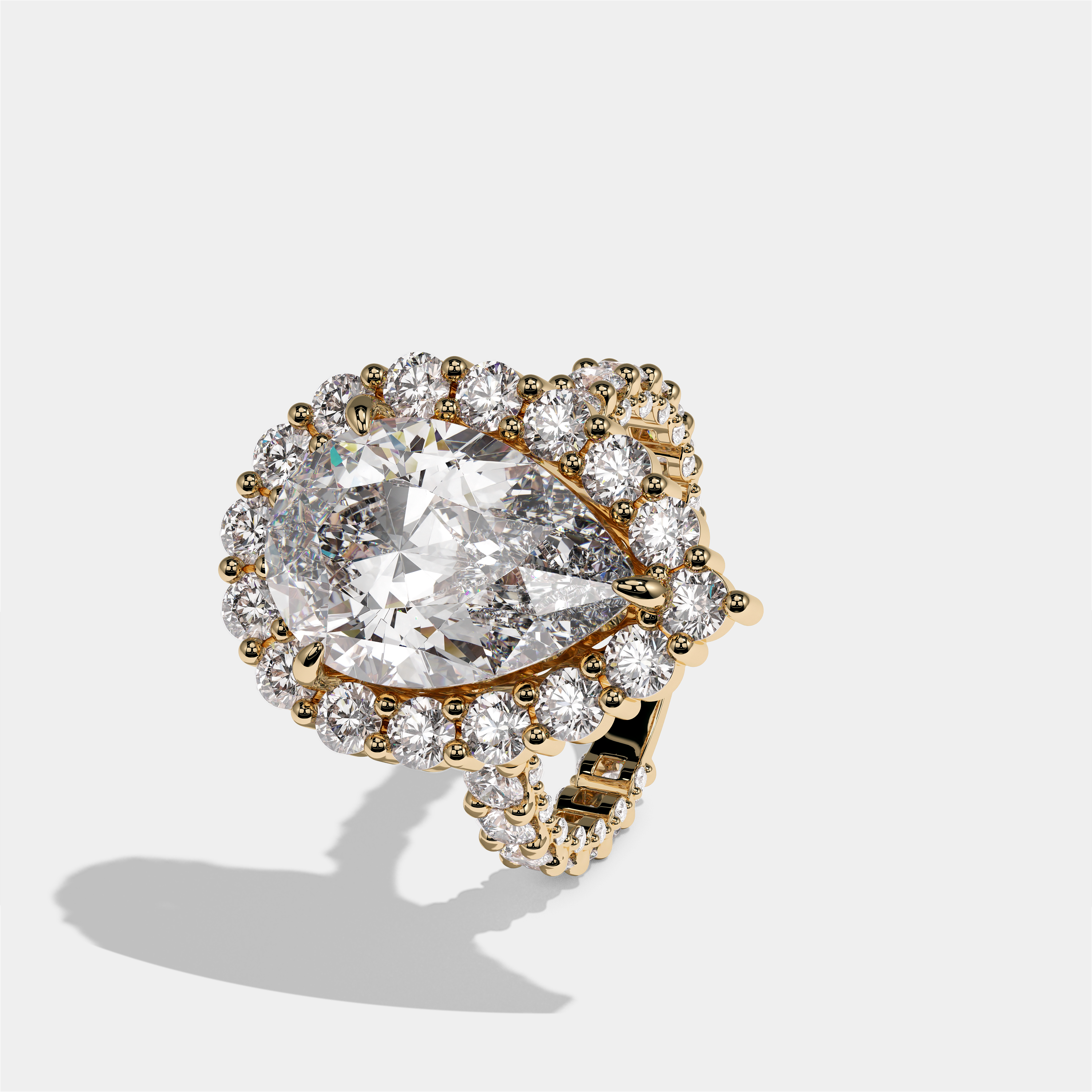 Judith Fairbourne diamond pear halo engagement ring in 18K yellow gold by Kurbãni Durjini, left view