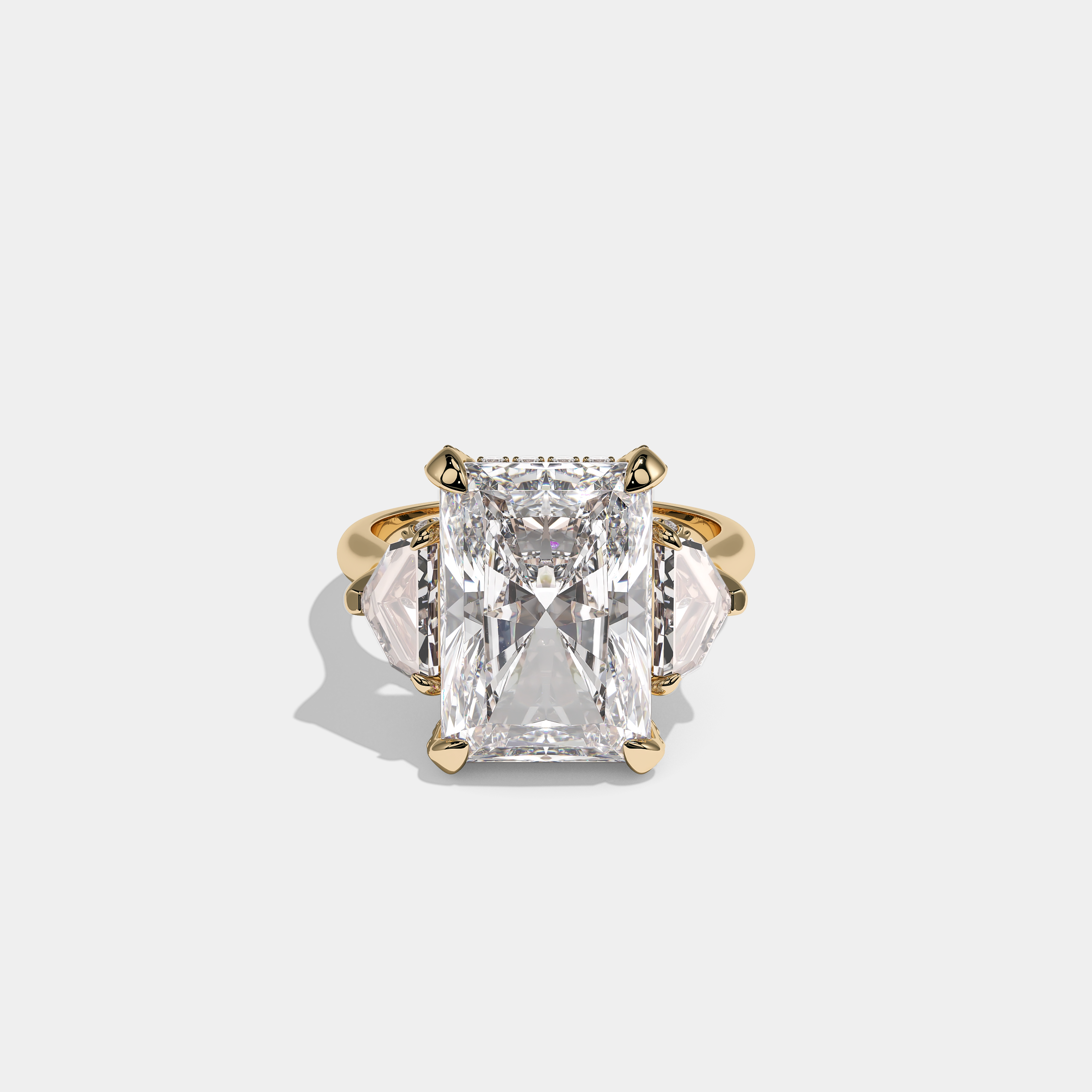 Nora Ashbourne diamond radiant halo engagement ring in 18K yellow gold by Kurbãni Durjini, front view