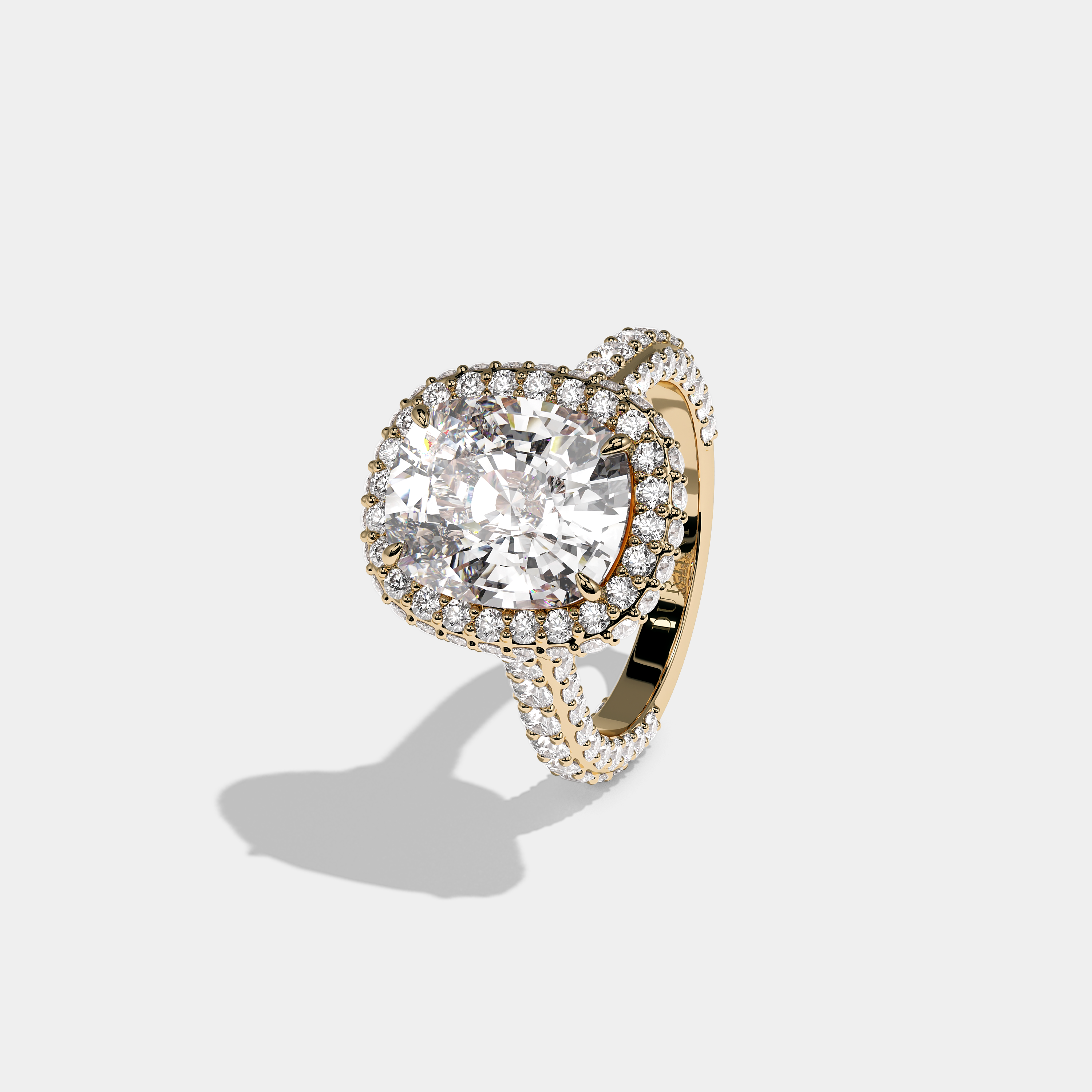 Shira Ravenscourt diamond cushion halo engagement ring in 18K yellow gold by Kurbãni Durjini, left view
