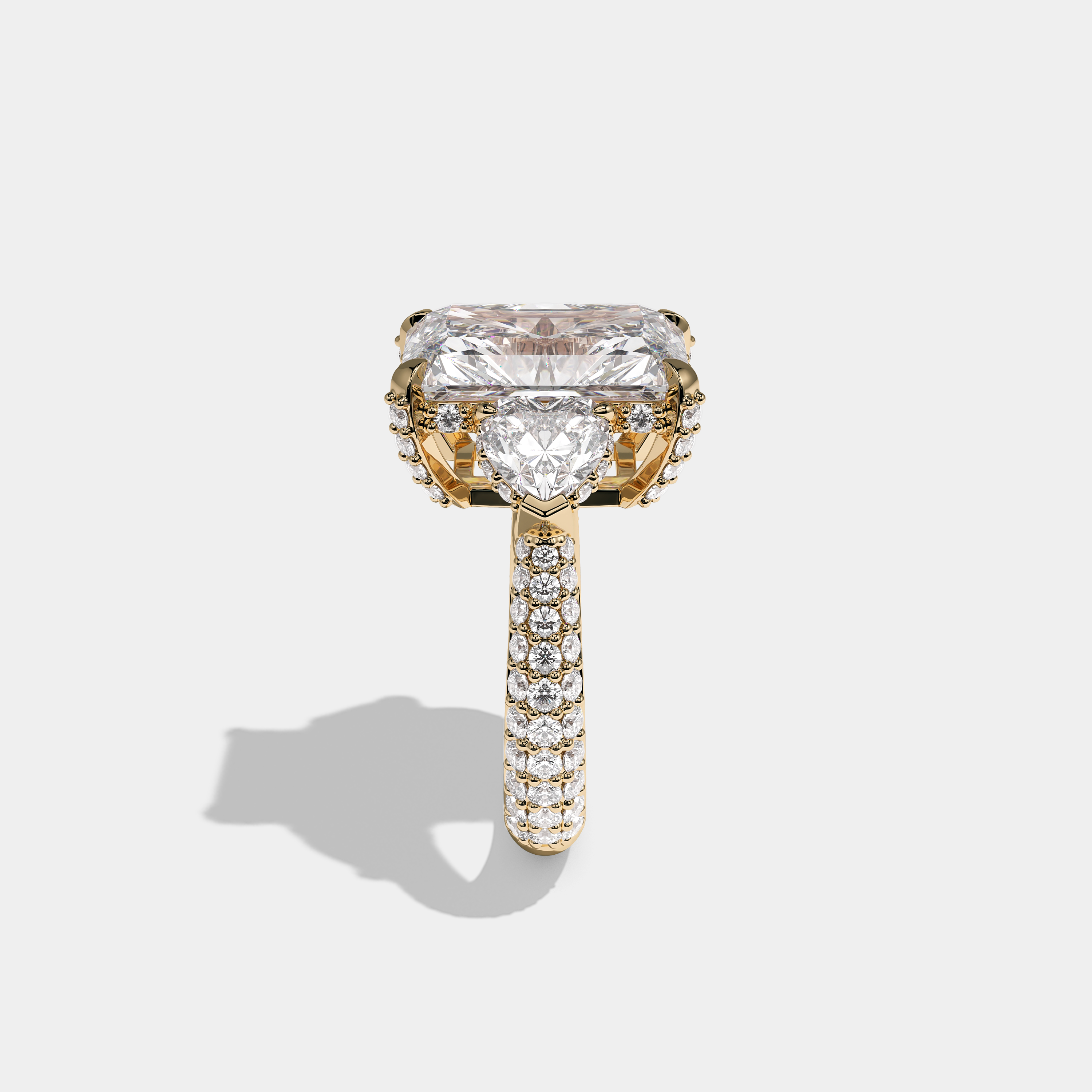 Luna Ashford 12.00ct diamond radiant halo engagement ring in 18K yellow gold by Kurbãni Durjini, side view