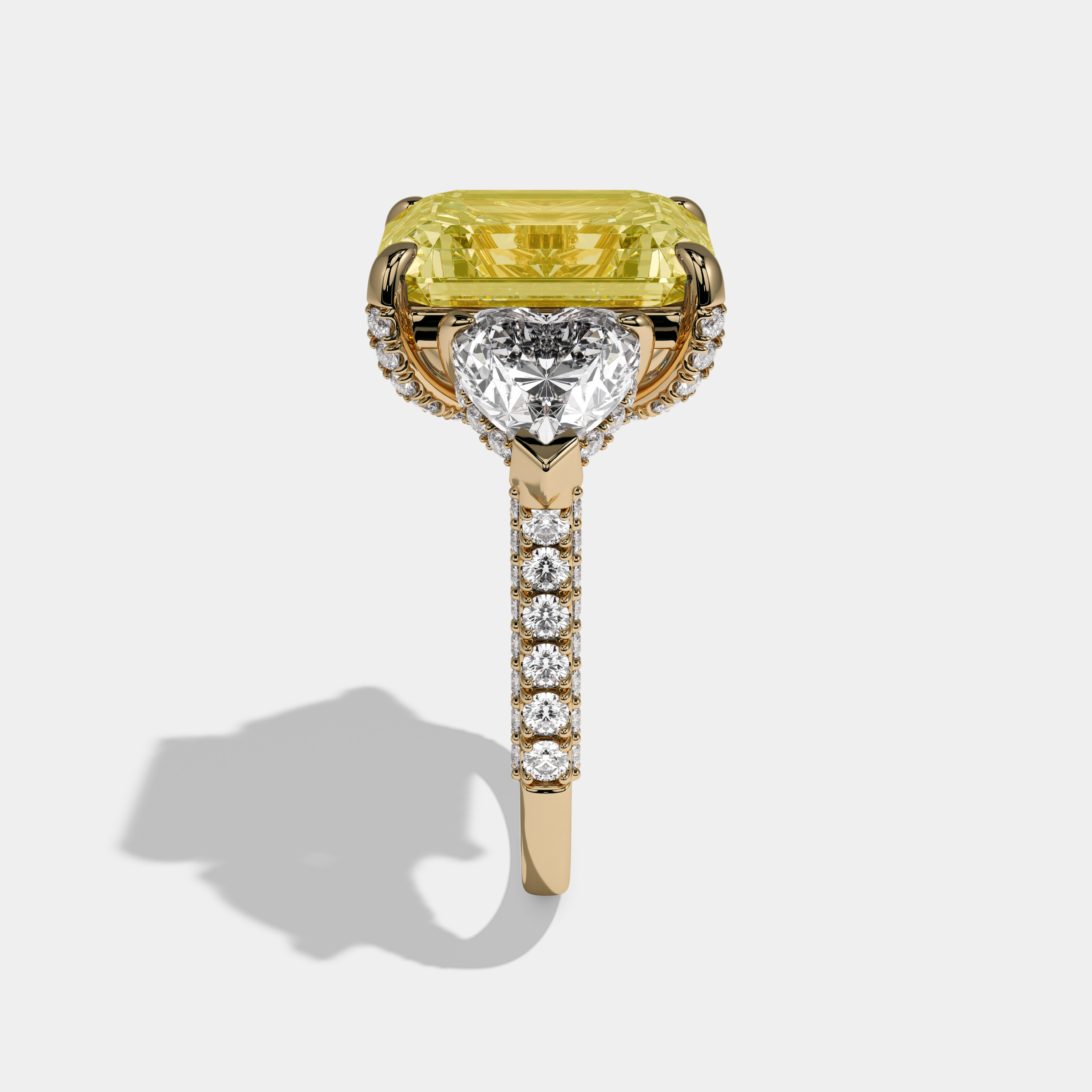Elizabeth Fancy Yellow Emerald Cut Diamond Halo With Twin Heart Sides Engagement Ring 10ct 18K Yellow Gold