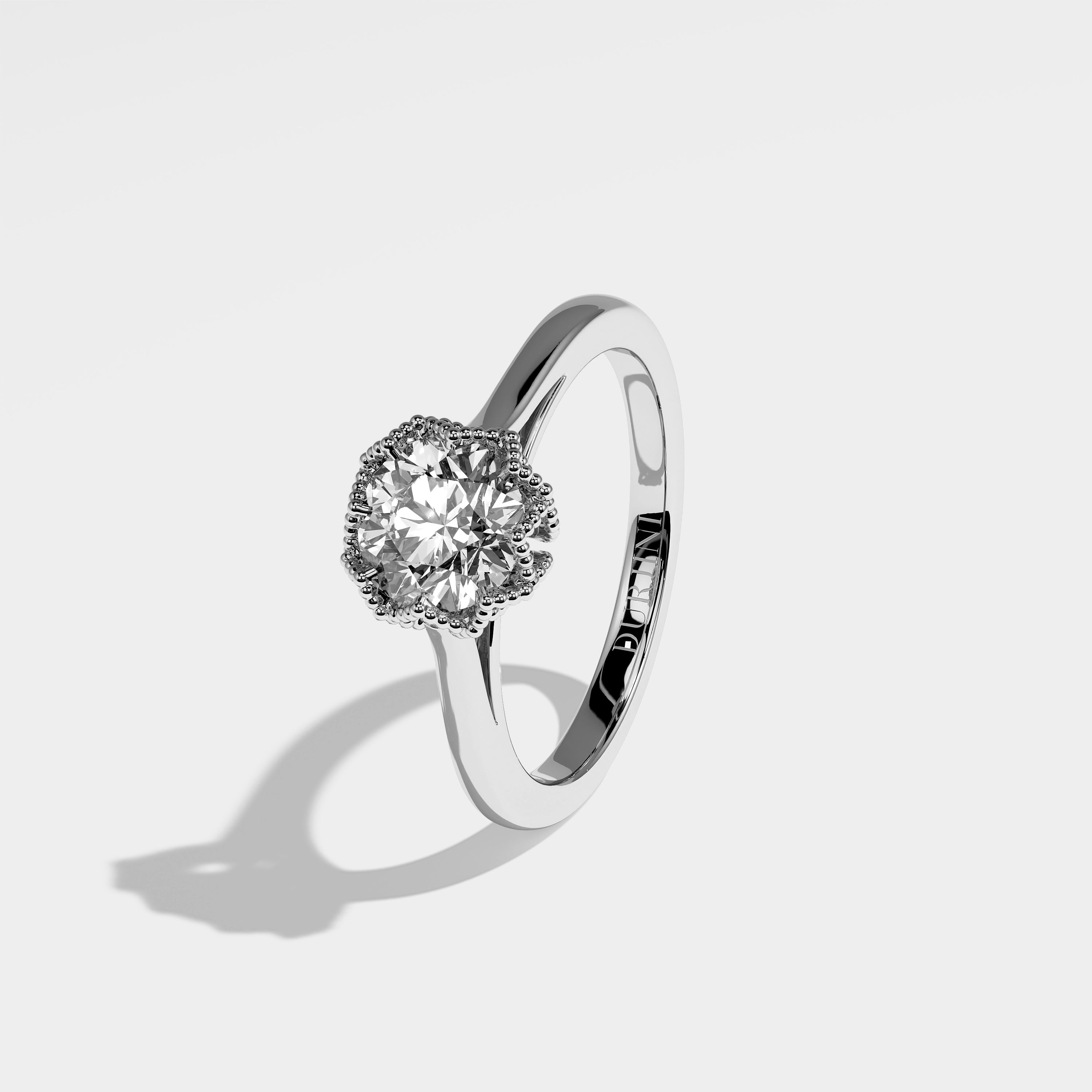 Lemon round brilliant diamond engagement ring in 18K white gold by Kurbãni Durjini, left view