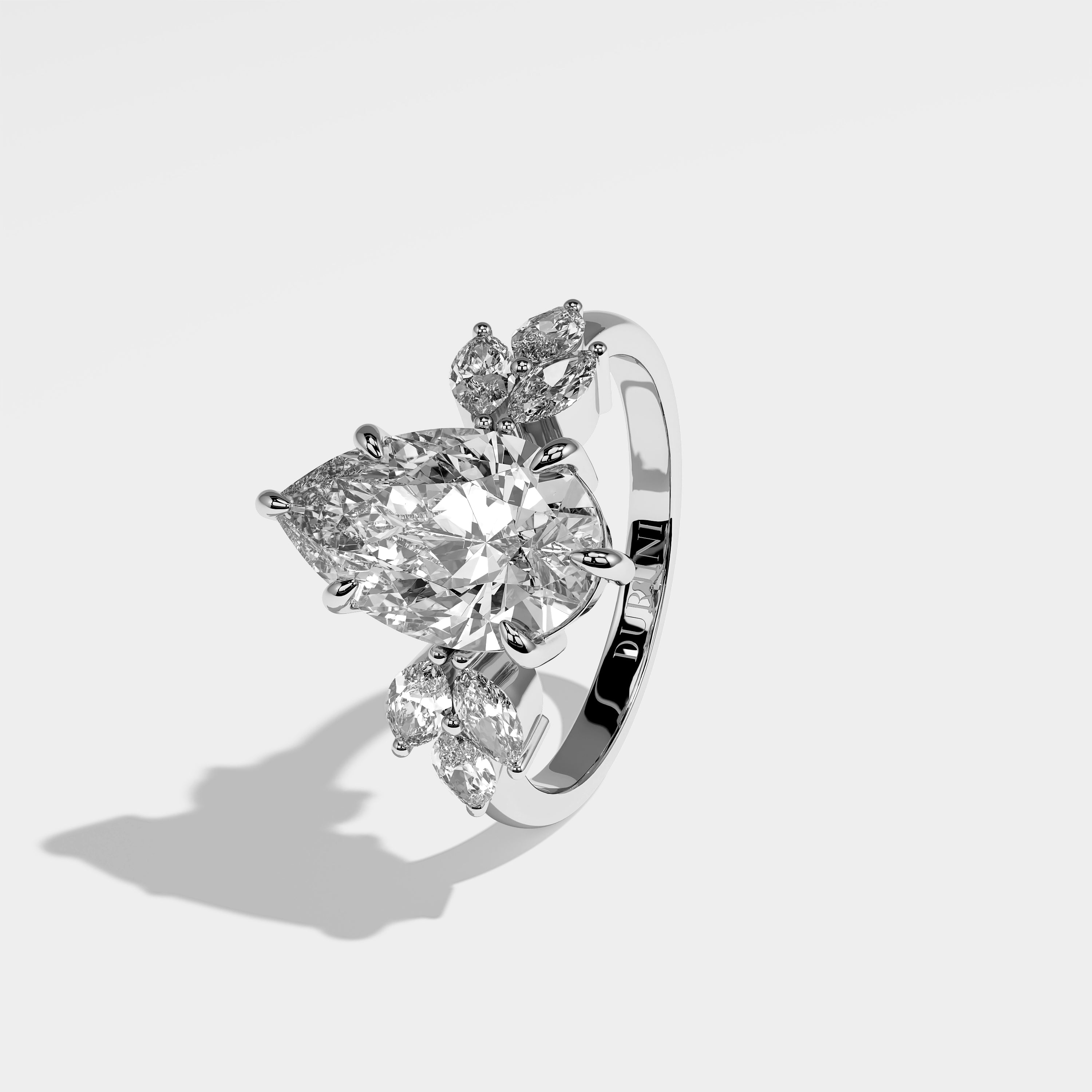 Hollow pear diamond engagement ring in 18K white gold by Kurbãni Durjini, left view